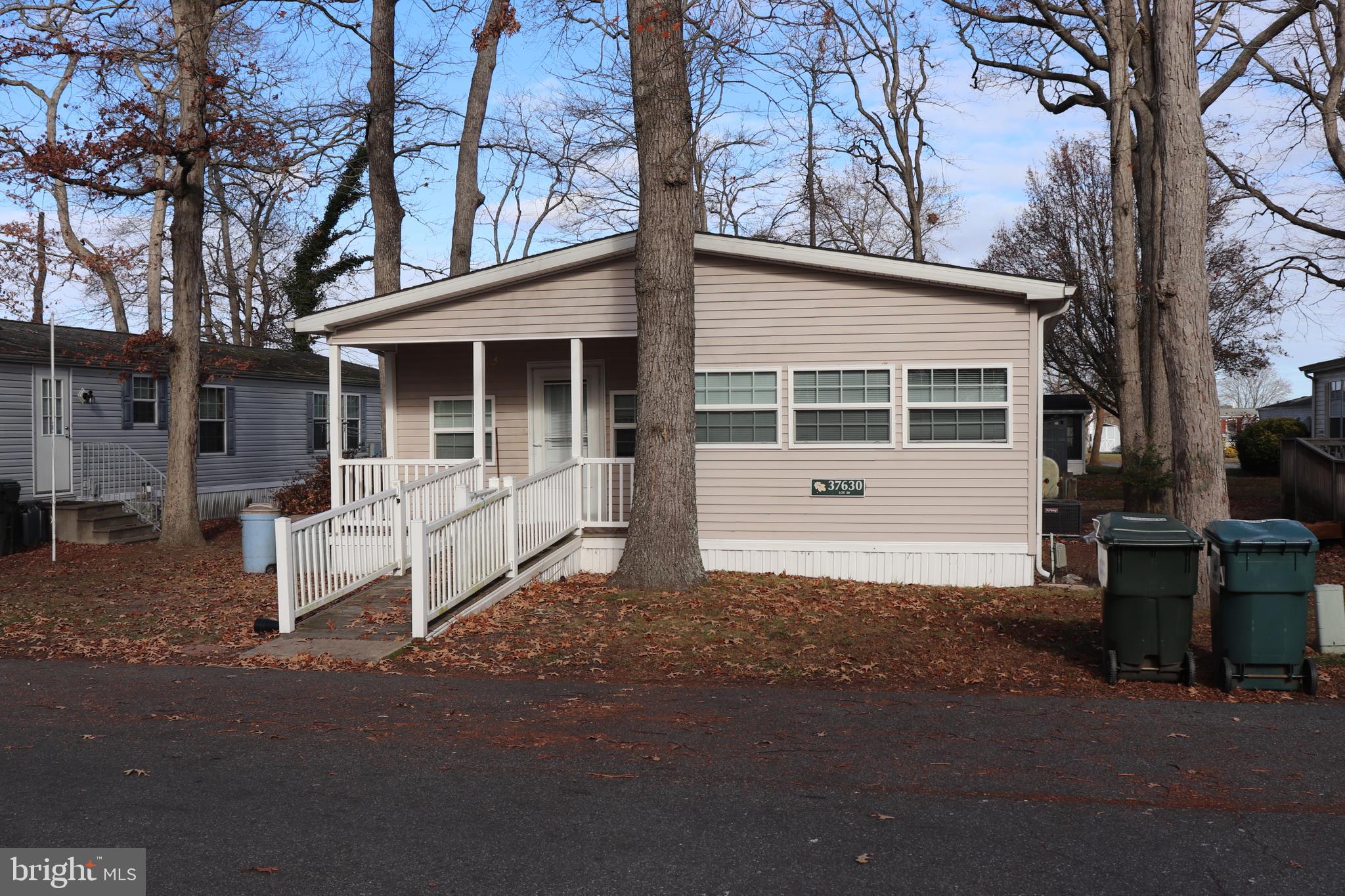 Welcome to 37630 W Shady Dr, a good sized 2 bedroom, 2 bath home, with room for a possible 3rd bedroom, in the desirable community of Shady Park, only about 3 miles from the beaches of Fenwick Island, DE and Ocean City, MD. This home has plenty of room for guests including 2 living areas and 1 with a fireplace. The kitchen has plenty of cabinet space, a breakfast bar and a good sized dining area. Both baths have walk-in showers. The community has a waterfront picnic area, playground, dog park and access to a boat ramp for a small annual fee. This home is close to shopping, restaurants, beach, bay, golf courses and Freeman Arts Pavilion, which hosts a Summer Concert Series featuring local and national acts.