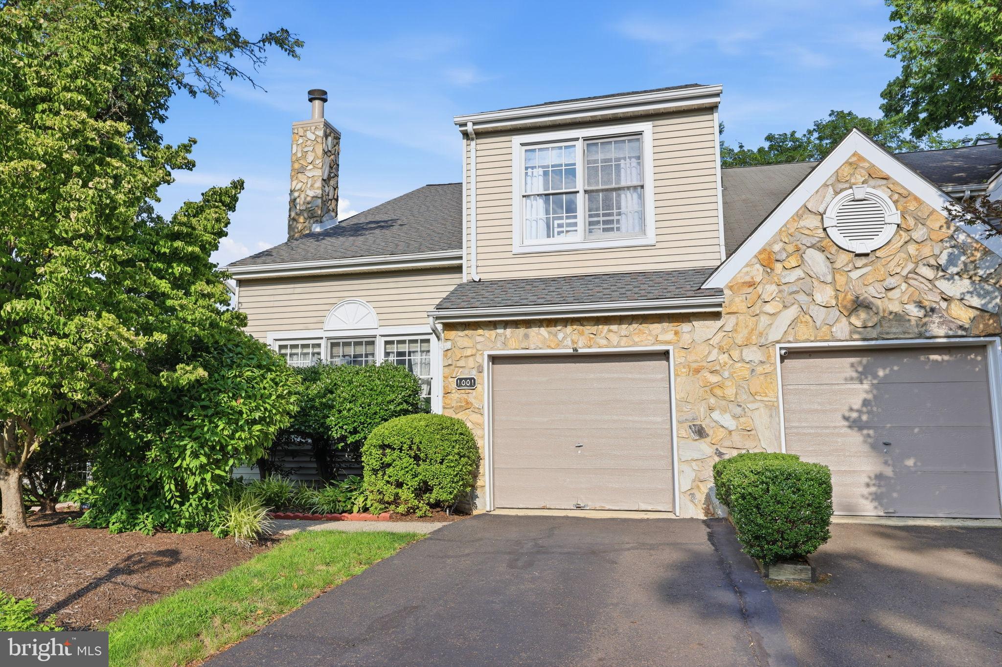 Welcome to this beautifully maintained end-unit townhome in the highly sought-after Greens of Doylestown. Offering approximately 2,630 square feet of living space, this 3-bedroom, 2.5-bath home combines spacious living with a prime location just minutes from Downtown Doylestown, shopping, dining, entertainment, Route 202, and the Pennsylvania Turnpike.

The inviting foyer opens to a sunken living room featuring hardwood flooring, a vaulted ceiling, and a wood-burning fireplace. The updated eat-in kitchen showcases white cabinetry, granite countertops, tile backsplash, hardwood flooring, and a bright breakfast area. The open-concept dining and family rooms provide an ideal layout for everyday living and entertaining, with sliding glass doors leading to a rear deck overlooking mature trees and open space for added privacy.

Upstairs, the spacious primary suite offers a walk-in closets and a private en-suite bath, while two additional generously sized bedrooms share a full hall bath. A convenient second-floor laundry area completes the upper level.

The fully finished walk-out basement provides exceptional additional living space, perfect for a recreation room, home office, fitness area, or media room, with direct access to the backyard. Additional highlights include an attached one-car garage, public water and sewer, natural gas heat, central air, and a desirable end-unit location. New garage door being installed.

Enjoy low-maintenance living in one of Doylestown Township's most desirable communities, within the award-winning Central Bucks School District.