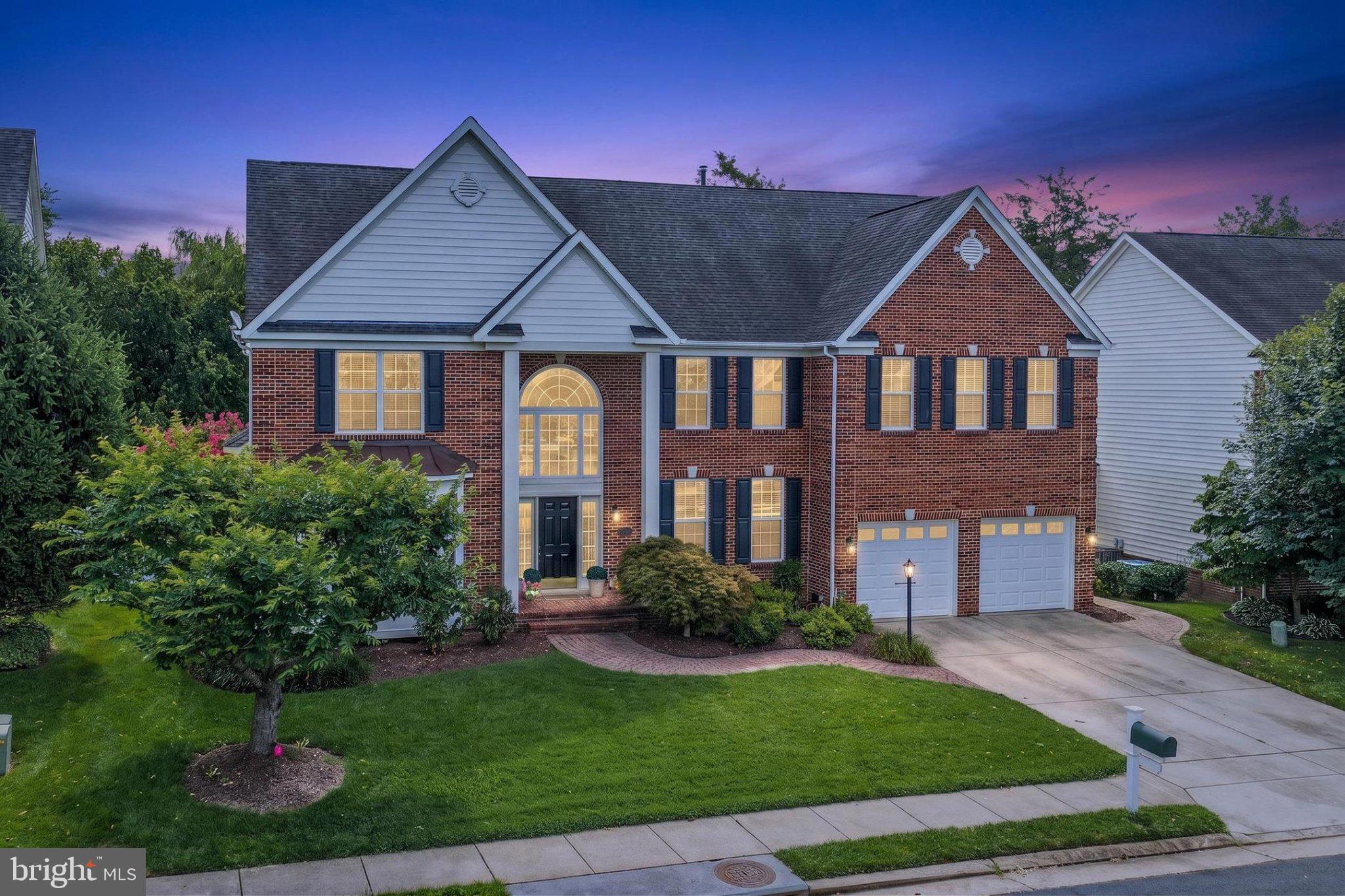 Welcome to 13621 Piedmont Vista Drive in beautiful Haymarket, Virginia! At the foot of the Bull Run Mountains, luxury, leisure, and resort-style living come together in the gated Piedmont community, where this beautiful 5-bedroom, 4.5-bath Colonial offers grand interiors, exceptional outdoor spaces, and an amenity-rich setting designed for everyday enjoyment. A tailored brick façade with a dramatic two-story portico entrance, 2-car garage, expert landscaping, screened porch, composite deck, paver walkways, picket fencing, underground lawn sprinkler, and lagoon-style in-ground saltwater pool create unforgettable curb appeal and outdoor distinction. Inside, soaring ceiling heights, hardwood flooring, custom window treatments, refined entertaining spaces, and a flowing layout deliver instant sophistication, while a thoughtful blend of personal and family-oriented zones provides room for gathering, retreat, work, and play.

A grand two-story foyer sets a memorable tone and welcomes you into the formal living room, where a bay window area fills the space with natural light. Opposite the foyer, the banquet-sized dining room is beautifully dressed for special occasions with hardwood floors, crisp crown molding, and an adjoining butler’s pantry that adds both style and service. At the heart of the home, the gourmet kitchen is designed to impress with striking quartz countertops, a custom Sub-Zero refrigerator, center island, generous table space, and an effortless connection to the breakfast area and sunroom. Nearby, the spectacular two-story great room offers a warm and inviting setting for daily enjoyment, while the screened porch and composite deck extend the living space outdoors. Descending stairs lead to a showstopping backyard retreat with a sparkling saltwater pool, waterfall feature, custom paver patio, verdant lawn, and privacy plantings, creating a seamless backdrop for summer gatherings, quiet evenings, and memorable celebrations. Back inside, the library offers an ideal retreat for work, reading, or quiet conversation, while a powder room completes the main level with polished convenience.

Upstairs, the gracious primary suite feels like a private sanctuary with a tiered sitting room, walk-in closet tailored with custom shelving, and luxurious en suite bath designed for true personal pampering. Separate vanities, a sumptuous soaking tub, separate water closet, glass-enclosed shower, and spa-toned tile create a serene setting for daily renewal. Down the hall, two junior suites enjoy generous closet space and shared access to a three-zone bath, while an additional bright and cheerful bedroom enjoys a beautifully appointed hall bath. The expansive walkup lower level delivers exceptional space, style, and versatility, creating a destination for game day, movie night, overnight guests, and casual entertaining. Family and friends can gather at the pub-style wet bar, step into the adjoining dart room, enjoy the billiards area, or settle in for a favorite film in the theater-style media room—there’s something here for everyone!

Home Theater Bonus: Enjoy a true cinema experience in the dedicated theater, pre-wired for immersive 7.2 surround sound and featuring a premium Klipsch 7.2.4 Dolby Atmos® home theater system. A stunning 110" premium projector screen is also included, making this entertainment space move-in ready from day one.

Recent updates: upper HVAC (2025), full Kitchen upgrade (2023), lower HVAC (2021), Water Heater (2019), Pool upgrades (2020). 

All of this is set within Piedmont, one of Haymarket’s most sought-after gated communities, offering common grounds, a community center, exercise room, golf club, jogging and walking paths, two outdoor pools, recreation center, tennis courts, and tot lots. With easy access to Old Carolina Road, Route 15, and I-66, the location balances quiet neighborhood living with everyday convenience throughout Haymarket and the surrounding area.