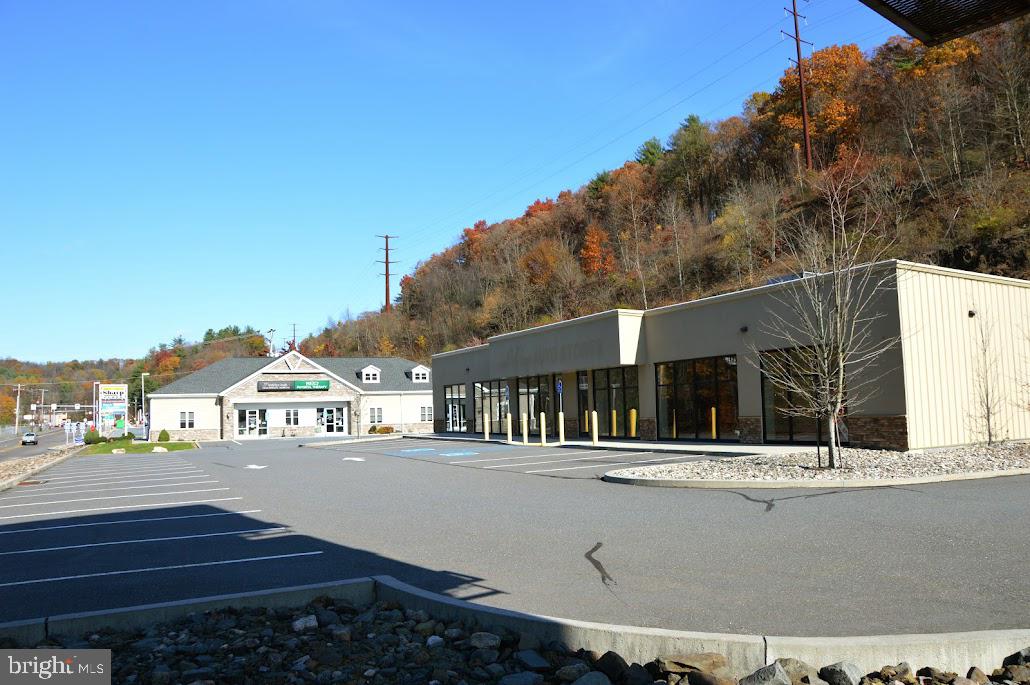 10,500 GLA.  Investment property or owner user of the 6,000 square feet of retail stand alone building.  120' x 50' vacant high profile 6,000 square foot building on pad site located along State Rout 901, Pottsville Pa.  Newly constructed and in great shape.  13'7" clear to joist.  Open floor plan allows for many uses.  One 6' x 10' high overhead door.  Great visibility from all directions.  Real estate taxes and property assessment are for both building on the site.    Fully occupied 4,500 square foot building with long term tenants.  Gross rent includes a proposed $14.50 PSF Base Rent occupant of the 6,000 square foot building and paying the estimated additional rent of $3.43.    Projected 9.5% CAP rate.
Owner willing to lease the vacant 6,000 SF building for $14.50 PSF, NNN, PASK2015466.   Call for details.
