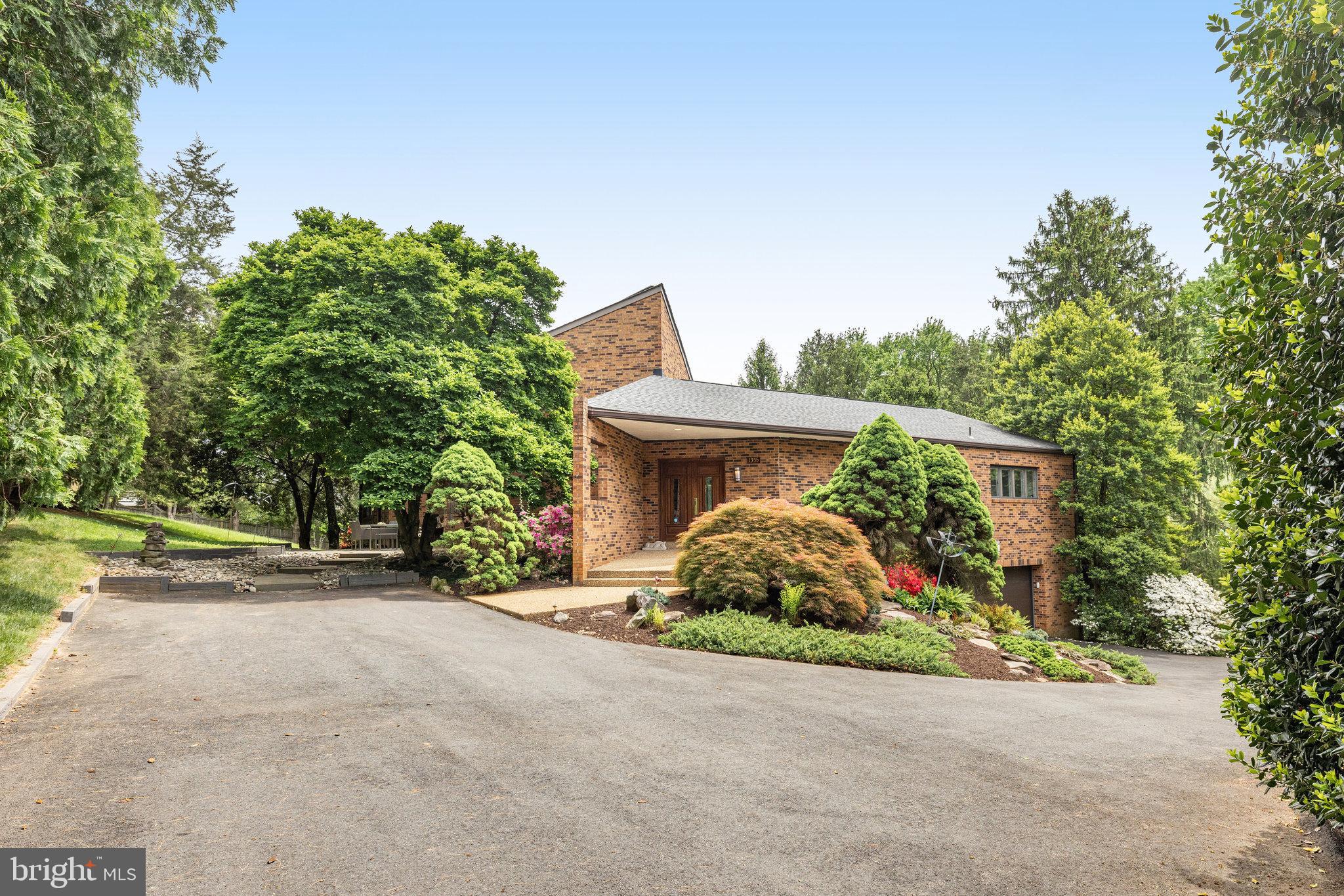 Welcome to this one-of-a-kind contemporary home in the lovely Windy Hill Neighborhood of McLean. The home is beautiful, and unique, and is sits on a .75 acre lot with park-like surroundings. The home has been updated through the years, and boasts 4 generous bedrooms and a modern, open floor plan. As you enter, the sightlines take you through to the wonderful natural light provided by the wall of windows that is the back of the home. To the right, you enter a formal intimacy of the spaces living room which is open to the kitchen and dining area. The kitchen has tons of counter space, high-end appliances, and a large pantry. This is a chef's dream!! The intimacy of the spaces is ideal! You are also connected to a spacious deck that overlooks the property and huge pine trees that provide the privacy you need!
The Great Room is amazing, with a gas fireplace and a wall of windows that provide more views of the property. the room also has plenty of wall space to display art and family photos! The primary is on the main floor, and is huge! The closet is custom and has plenty of space, and the bathroom is everything you need!
Upstairs, there is a nice loft that can be an office, homework nook, or just a lounge, along with 2 bedrooms and an updated bathroom. The basement is open, with plenty of room to carve out a rec room, or whatever you need! Walkout to the yard here, and also enter the 2 car garage. In addition, the 4th bedroom provides a private oasis, with its own private, updated bathroom, as well. There is also ample storage and the laundry on this level. 
This home is so unique, you must visit it to understand it's true glory! The space and the flow is great for entertaining, and the property is lush and private. There is a cohesion with the exterior and interior that is so pleasant! The location is amazing, as well, with easy access to Tyson's, commuter routes, downtown McLean, DC, and so much more! Come see what 1355 Windy Hill has to offer for your next dream home!!