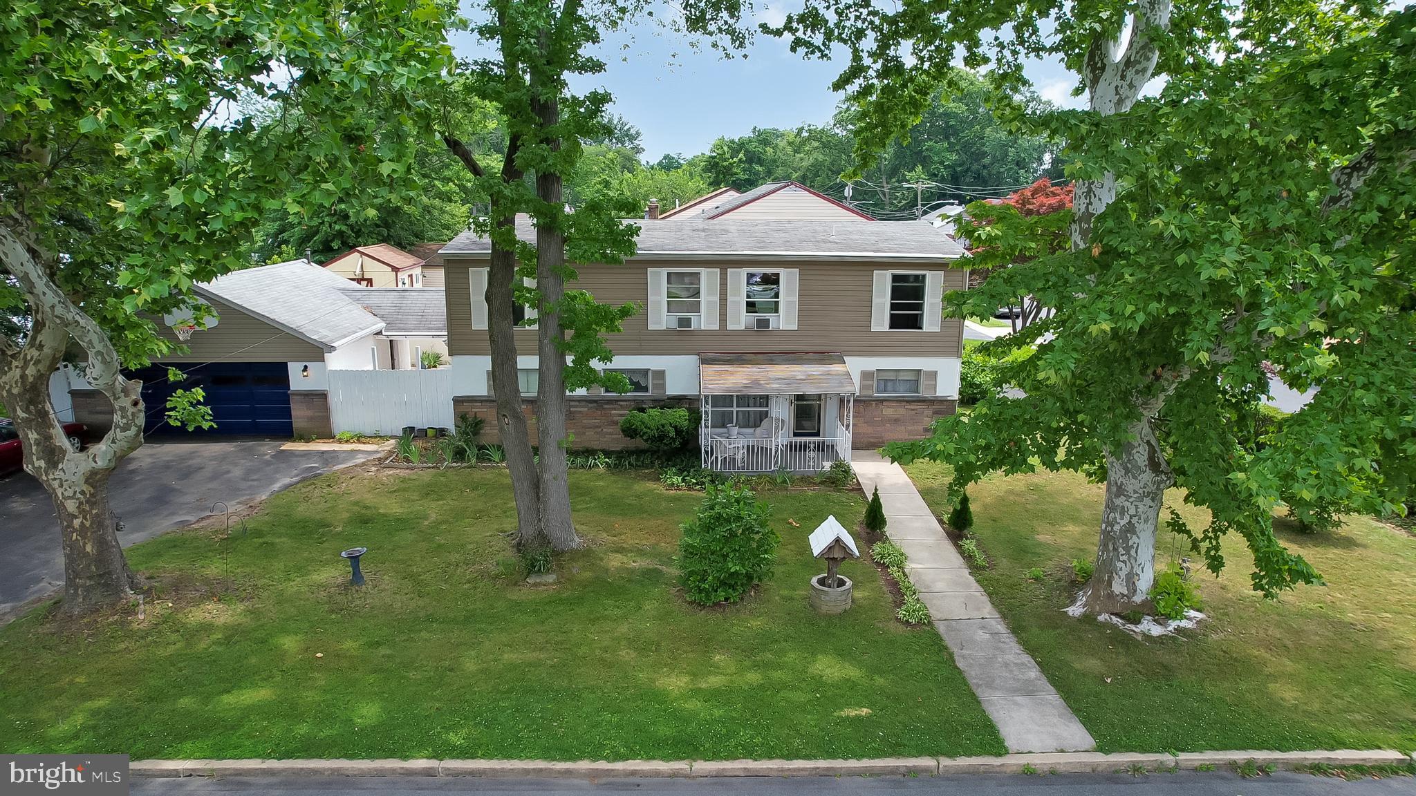 Situated on a prominent corner lot in Ridley Township, this versatile home offers over 2,000 square feet of living space and a flexible floor plan ideal for those seeking additional room, multi-generational living arrangements, or a variety of work-from-home and lifestyle options. With the potential for 4 to 6 bedrooms spread across two levels, a full bathroom on each floor, a detached two-car garage, and parking for 6+ vehicles, this property offers exceptional functionality both inside and out.

The main level provides the convenience of one-floor living with multiple bedroom configurations to suit your needs. A full bathroom featuring a roll-in shower enhances accessibility and makes the home especially accommodating for those requiring mobility assistance. The spacious living room flows into a large bonus room currently utilized as a bedroom, while the kitchen offers ample workspace with a convenient peninsula. A rear bedroom includes a side exterior entrance leading to the partially covered breezeway, creating an ideal setting for a home office, sitting room, or private retreat. Cedar and linen closets provide additional storage options throughout the first floor.

Accessible through the laundry area with its own exterior entrance and access to a separate driveway along Hutchinson Avenue, making it well-suited for extended family, guests, or private living quarters. This space gives access to the upper level, which includes a spacious family room with existing plumbing should a future kitchenette be desired, a generous living area, a large bedroom with multiple closets, 2 additional bedrooms, a walk in closet, and a full bathroom.

Outdoor amenities include the partially covered breezeway perfect for entertaining, an oversized detached two-car garage, and abundant off-street parking. Conveniently located directly across from a township playground and within walking distance to shopping and everyday conveniences, the home also offers easy access to Routes 420, MacDade Boulevard, I-95, and I-476. Philadelphia, Philadelphia International Airport, tax-free Delaware, and King of Prussia are all within approximately 30 minutes, making this a fantastic location for commuters and travelers alike.