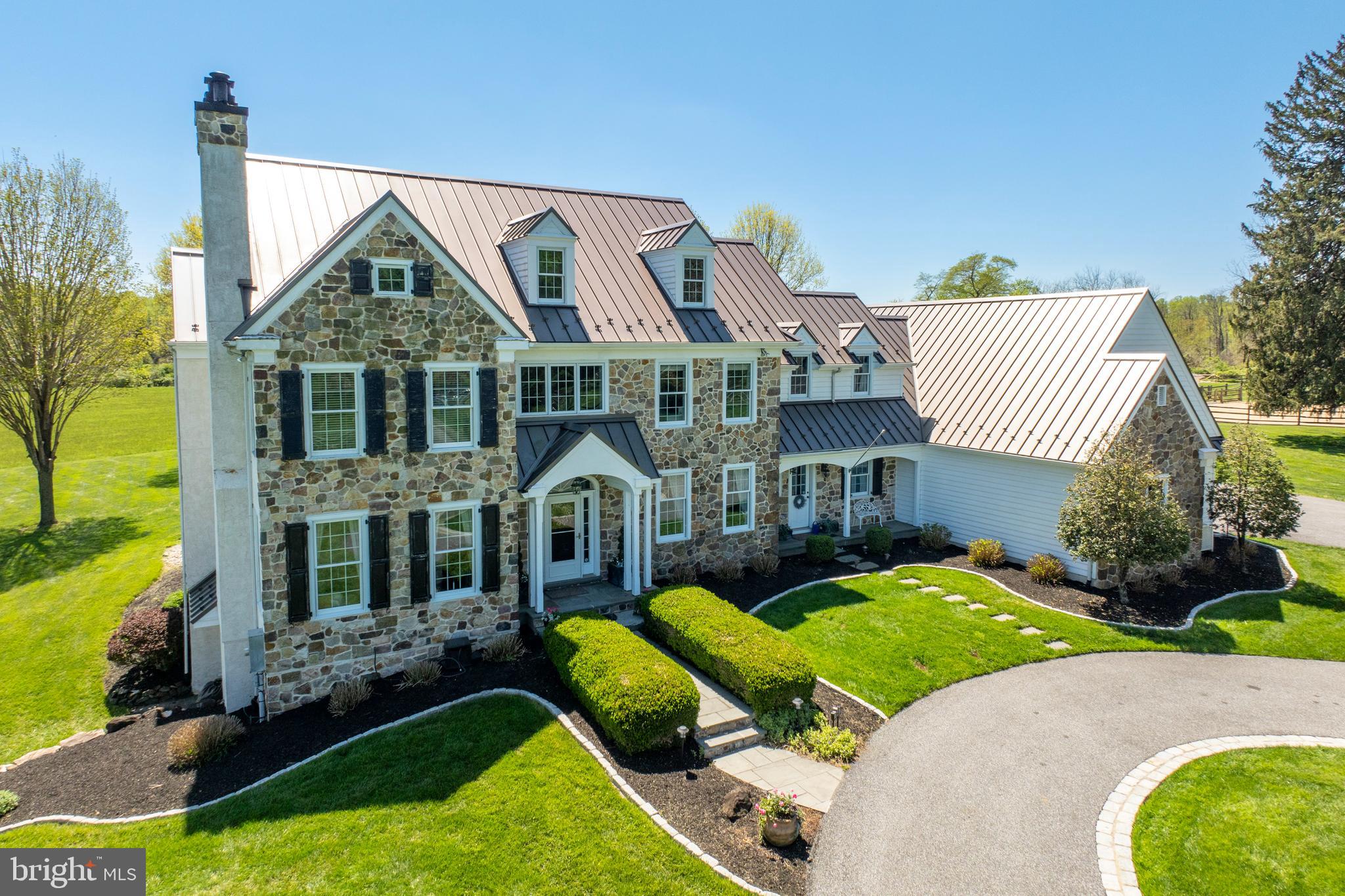 Impeccably maintained 5-acre farm, perfectly located in historic Chadds Ford, with ease of access to Kennett Square, West Chester, the Main Line, Wilmington and Philadelphia.  This property offers a perfect lifestyle balance including private unencumbered views of the Brandywine Conservancy, an intentionally designed home built for entertainment, a charming fieldstone barn with manageable pastures - all within reach of the Brandywine Valley’s cultural entertainment.

Located near the Brandywine River Museum and famed Wyeth countryside, you will enter the property on a meandering lane flanked with period homes and well-maintained farmettes.  The custom-designed Colonial home was originally constructed in 1999 and features beautifully pointed fieldstone, a classic standing seam roof, an attached 3-car garage, a beautiful flagstone patio and a rectangular pool with fountains and a wading shelf.  This outdoor oasis is surrounded by a perfectly manicured lawn and professional landscaping with mature plantings for privacy.  

The fieldstone barn was intentionally built for ease of maintenance, with four 12x12 stalls, one 12x16 foaling stall, a large tack room, hay loft, overhand for equipment storage, an attached sand paddock, a 70 x 90 sand arena, and 4 grass paddocks, 40 x 40 dry paddock.  The facility is appropriate for horses or other livestock, and for the equestrian enthusiast, within easy hauling distance to numerous horse events and endless riding in Cheshire or Radnor Hunt country! 

Entering the 4700+ square foot home, you will be greeted by an abundance of light, high vaulted ceilings, gorgeous hardwood floors. A Chefs dream kitchen with top culinary appliances by Thermador, including  a walk-in pantry.  The first floor is thoughtfully laid out for animal owners, with a large mudroom and first-floor laundry room, located near the kitchen and garage door closest to the barn.  There is a formal dining room for special occasions, but the large 31’x18’ family room is attached to the kitchen for those cozy evenings spent by the fireplace.  There are also 2 half-baths and a spacious family room with a formal fireplace - to round out the main floor living experience.

A gracious L-shaped staircase takes you upstairs where you will find 3 bedrooms with a full detached bath, suitable for  guests.  The 21x14 master suite has his and her walk-in closets and views from every window, including a pastoral view of the Brandywine Conservancy from the Jacuzzi soaking tub in the large ensuite bathroom.  Recently added to the 2nd floor is an incredible bonus room above the garage, with exposed beams and a vaulted ceiling, which was renovated and soundproofed to serve as a music studio.

The square footage of the home also includes an enormous finished basement (1,000+ sq ft) with a hand-crafted mahogany bar with seating for 6, an adjacent movie room, a fitness center, a full bath, and tons of additional storage space with an enclosed utility space.  The basement was created with the serious entertainer in mind.

Located in Pennsylvania’s top-ranked Unionville Chadds Ford School District, the elementary school is a short one-mile drive from home.  This is an ideal property for a family looking for an easy-to-manage farmette, situated within reach of the suburban conveniences of Pennsbury Township!