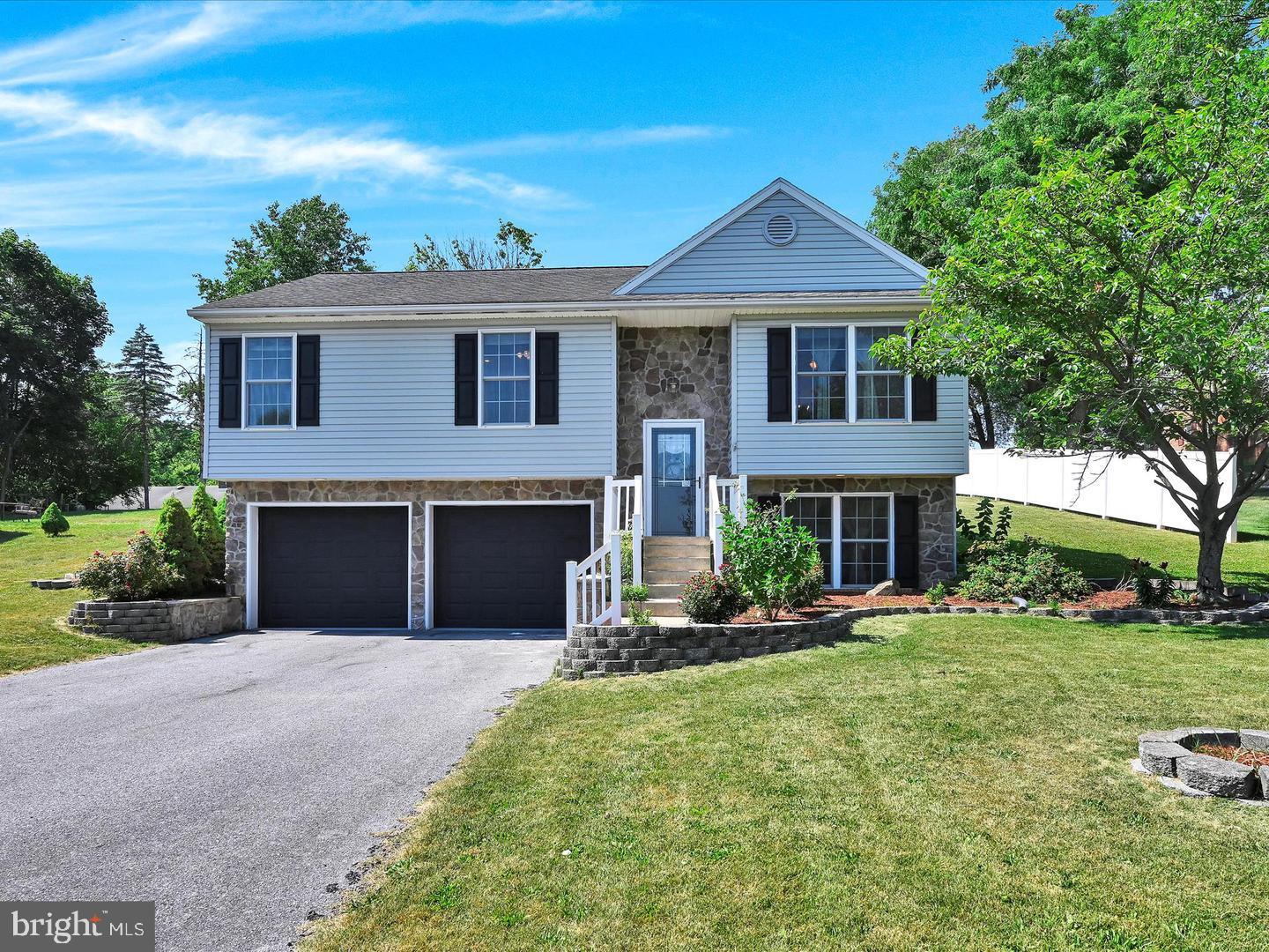 Nestled in the serene North Lebanon Township, this exquisite bi-level home offers a perfect blend of luxury and comfort. Built in 2005, the property showcases a stunning exterior with elegant stone and vinyl siding, complemented by beautifully crafted stone retaining walls that enhance its curb appeal. Step inside to discover a thoughtfully designed interior. The kitchen is equipped with a built-in microwave, electric oven/range, and a sleek dishwasher, ensuring culinary delights are just a step away. The family room, conveniently located off the kitchen, creates a warm atmosphere for relaxation and gatherings. This residence boasts three spacious bedrooms and two full bathrooms, all well maintained. The fully finished daylight lower level offers additional living space, complete with garage access. Outside, the expansive 0.41-acre lot features a beautifully landscaped front yard and a large deck, ideal for outdoor entertaining or enjoying peaceful evenings. With an attached two-car garage and a private asphalt driveway, convenience is at your fingertips. Experience the exclusive lifestyle this remarkable home offers. Continue to rent it out for income or make it yours. Schedule your showing today.