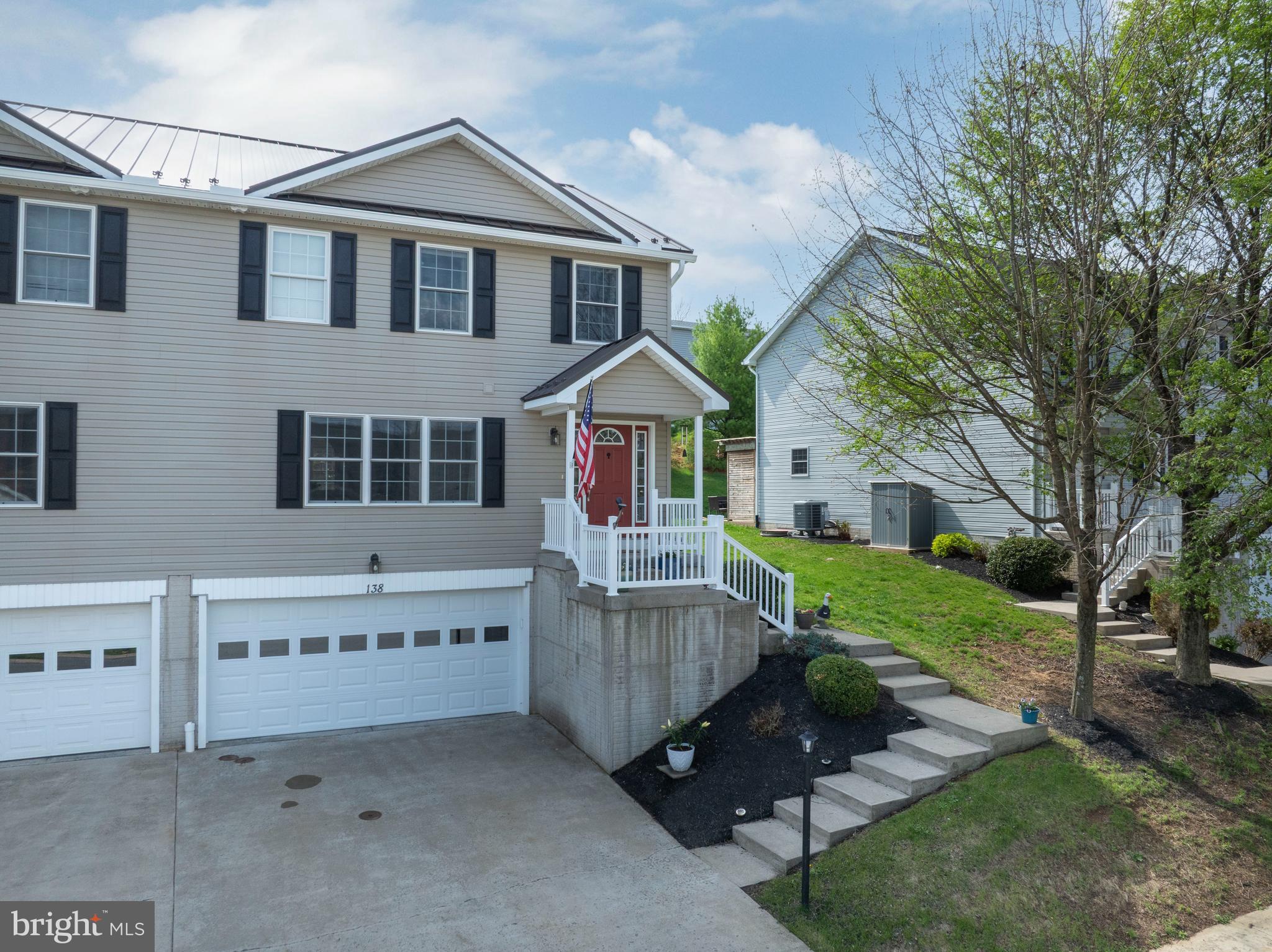Conveniently located with easy access to I-99, this spacious condo offers quick commutes to PSU, State College, and Bellefonte. The bright main level features a large welcoming foyer, arched wall openings, an eat-in kitchen with a large island, and a comfortable family room with a corner gas fireplace. Step through the glass door to the rear patio that is perfect for grilling and outdoor entertaining. Upstairs, enjoy a convenient laundry area and a roomy primary suite with a walk-in closet and full bath. The lower level includes a clean two-car garage plus a versatile bonus room ideal for a workshop, storage, an exercise space, or hangout area. Enjoy beautiful mountain views, a nearby walking path and park, plus the peace of mind of a new roof installed in 2025. This move-in ready home offers comfort, convenience, and low-maintenance living in a desirable location. Come take a look!