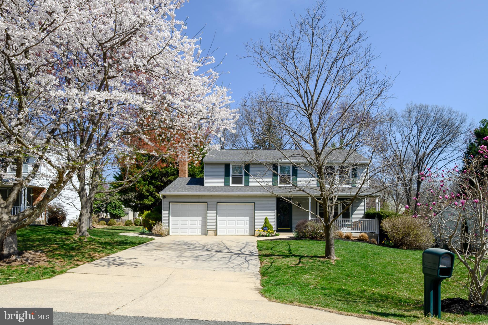 ****OFFER DEADLINE**** Monday 4/7/25 at 5 pm.  Welcome to this charming home, located on a peaceful cul-de-sac on a beautiful, private lot.  As you approach, a welcoming front porch invites you into the home.  Inside, this beautifully maintained 4 bedroom, 2.5 bath home features an upgraded kitchen with lovely cabinetry accented by crown molding, under cabinet lighting, a stylist backsplash, and plenty of cabinet space.  The kitchen and family room open onto a spacious sunroom with adjoining deck and built-in hot tub, creating the ideal space for both relaxation and entertaining.  The family room features hardwood flooring, a gas fireplace (with remote) that is flanked by upgraded and decorative built-in cabinets, with French doors that flow seamlessly into the sunroom - one of the home's most outstanding features! This bright space is perfect for reading a book, enjoying quiet afternoons, or hosting guests.  The spacious living room and dining room, both feature beautiful hardwood flooring.   Upstairs, you'll find four generously sized bedrooms, including a bright primary suite with a walk-in closet and a beautiful en-suite bath with double vanities.  One of the bedrooms is currently a den/office with built-in shelving and there is a brand-new hallway bath/shower.  This home also features a large crawl space with moisture barrier and climate control, plenty of parking including a two-car garage (garage doors can be operated from anywhere in the world, using a phone app.), a lovely concrete walkway that leads you to a fully fenced yard, complete with a brick paver area designed for a fire pit.   The roof was replaced in 2024, and there's a very low HOA fee of only $84 a year!  Don't miss out on this exceptional property that has been meticulously maintained!