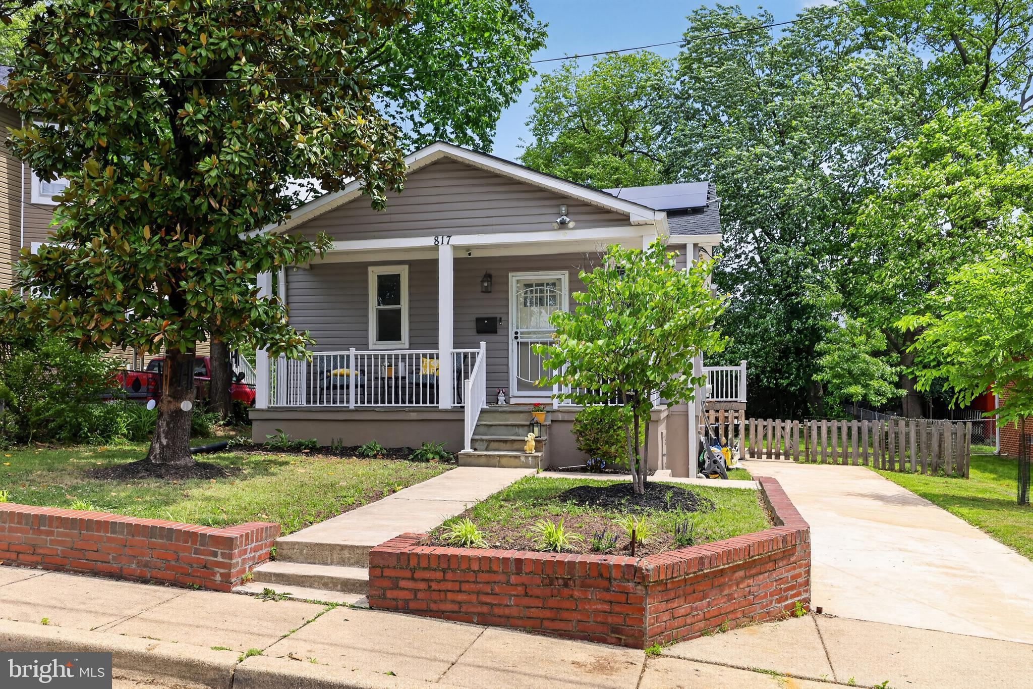 Built in 1945, this darling bungalow carries its history well, thanks to a thoughtful remodel in the past that addressed the big things: siding, roof, HVAC, kitchen, baths, and hardwoods, and ongoing care. The slate-tiled front porch leads into an open main level where the living, dining, and kitchen spaces flow easily together. The beautiful hardwood floors carry through the main level, giving the home a warm, cohesive feel. The kitchen has a gas cooktop, built-in microwave & wall oven, upgraded counters & tiled backsplash; updates that make this space both functional and inviting. The primary suite includes a full bath with a walk-in shower and a walk-in closet. Main-level laundry adds convenience and keeps daily life simple—two additional bedrooms and a second full bath complete this level. The lower level adds flexible bonus space with its own side entrance. It's great for a workout area, hobby room, or whatever you need extra space for. There's also a generous storage area to keep the upstairs clutter-free. Outside, you'll find off-street parking and a fully-fenced yard. And then there's the solar. With utility costs climbing, this system makes quite a difference! It's under a PPA and transferable to the buyer. 817 57th Pl is a well-kept home with smart updates and surprising extras. It's the kind of home that feels good the moment you step inside. You'll understand when you see it!