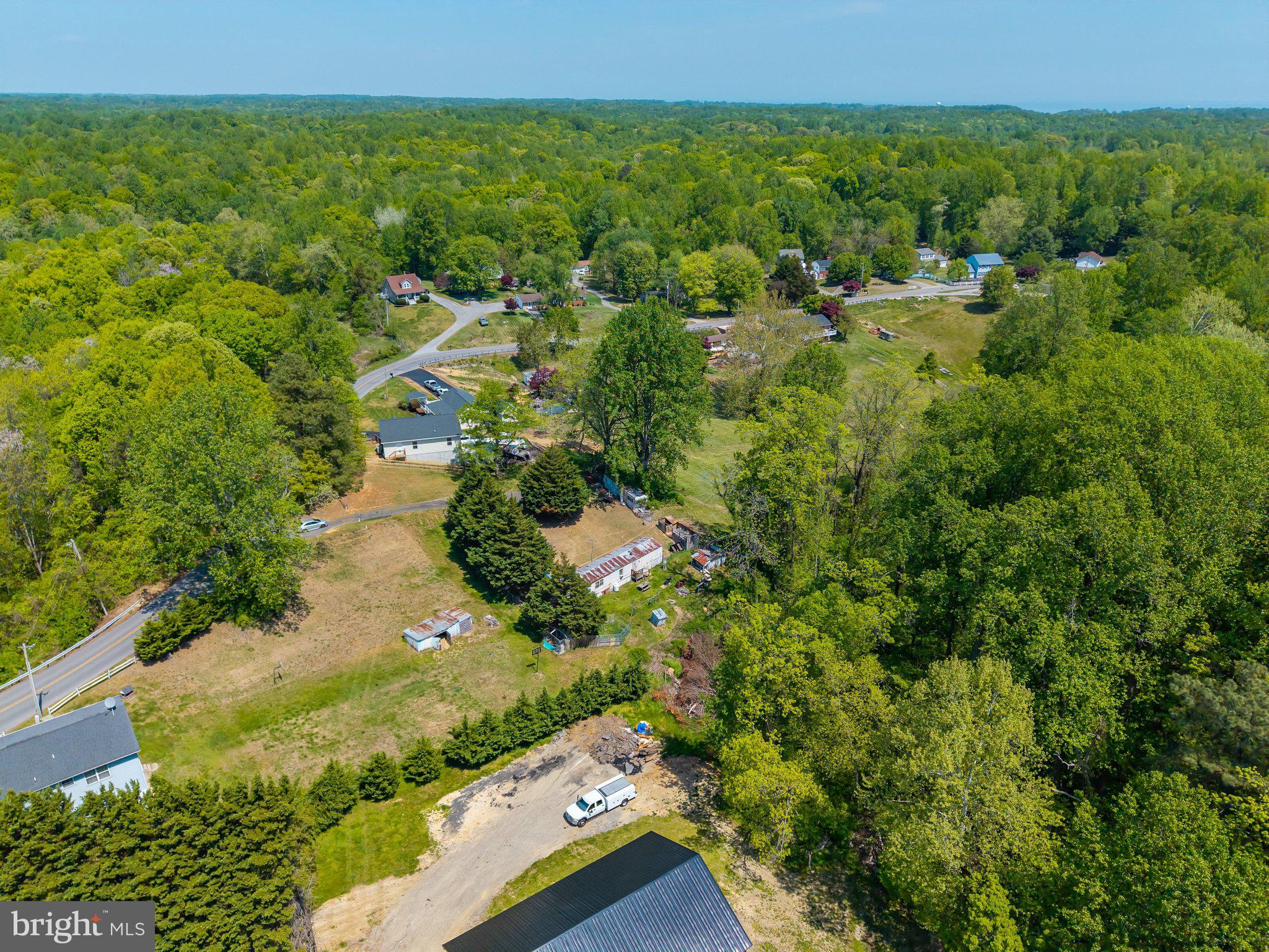 Set on over three acres along a quiet residential road, this property offers a blend of open space and flexibility for future plans. With well and septic already in place, the groundwork is set for building a new home tailored to your vision. An existing mobile home provides two bedrooms, two baths, and approximately 720 square feet of living space, offering an option for temporary use while construction is underway or for immediate occupancy. Much of the land is cleared, creating opportunities for a variety of uses. Buyers may explore the potential for additional homes or enjoy the privacy and space of a larger homesite. Conveniently located with access to nearby beaches, parks, and commuter routes to Washington DC, Annapolis, and Northern Virginia, this property combines a peaceful setting with everyday accessibility.
If you are considering building or investing in land with existing infrastructure, this is an opportunity worth exploring.