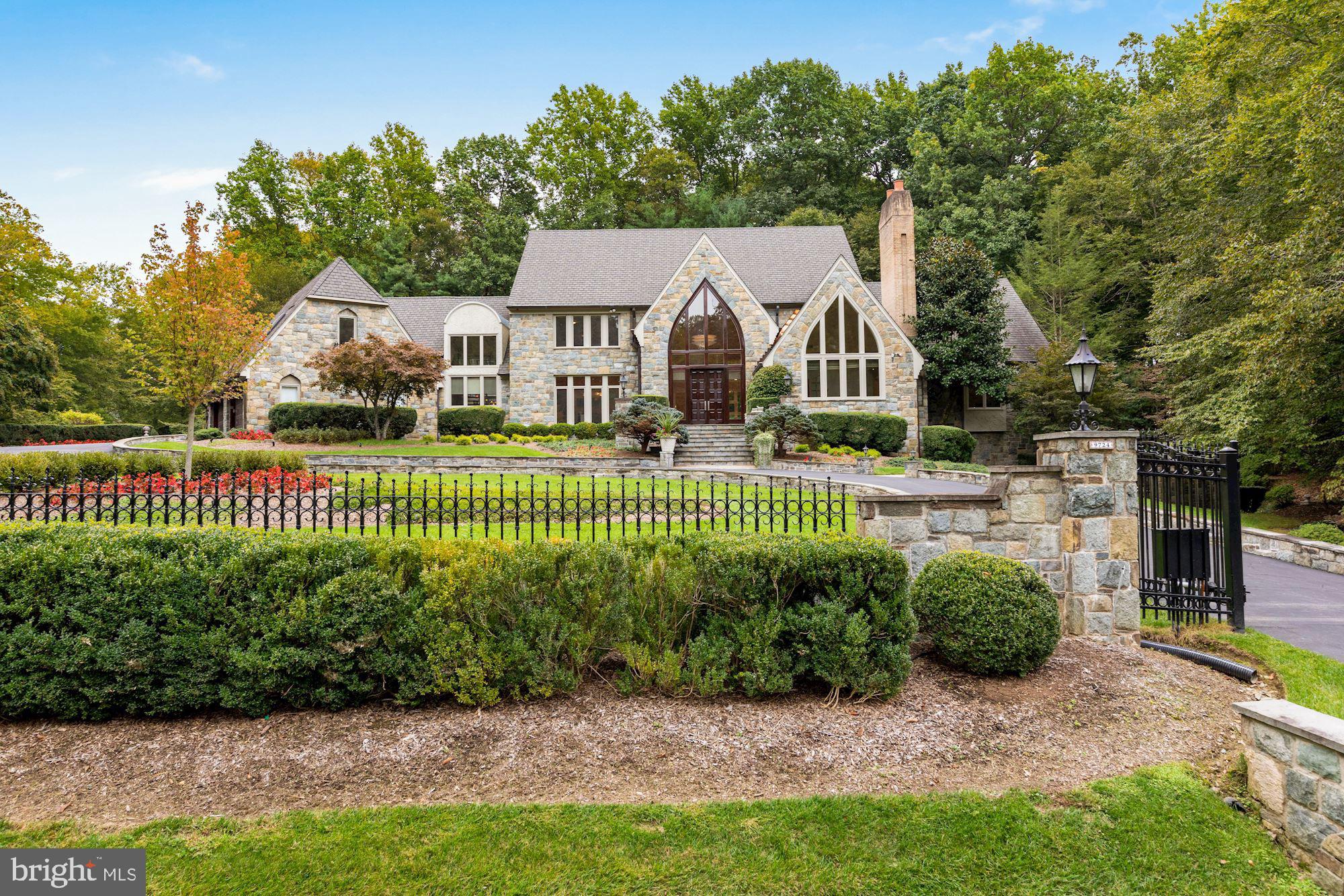 Welcome to 9724 Sorrel Avenue! This stunning gated estate is situated on just over 2 acres of land within the Falconhurst community in Potomac. With over 14,000 square feet of living space this home truly has it all. The highlights of this home include a gorgeous indoor swimming pool with spa, 4 car garage, and private in-law suite. In total there are 6 bedrooms, 7 full bathrooms and 2 half baths. The main level features a grand entry with a two story cathedral ceiling. You have spacious formal living and dining rooms. The cathedral ceilings continue in the family room with gorgeous views of the backyard and a wood burning fireplace with floor to ceiling stonework. The eat-in chef's kitchen has tons of natural light with stainless steel appliances, a large island, and custom two tone cabinetry. The kitchen has direct access to the large slate stone back patio perfect for indoor outdoor living. The main level also includes a private office with fireplace and custom millwork. Lastly, the main level master bedroom has vaulted ceilings and floor to ceiling windows letting in tons of natural light. You have beautiful views of the trees and foliage as well. The master ensuite has double sinks with a built in vanity, soaking tub, and walk-in tile shower. There is also a walk-in closet with a custom closet storage system and a private balcony overlooking the grounds. Perhaps the coolest feature of this master is the direct access to your indoor swimming pool via a spiral staircase. The upper level of this home features 4 additional bedrooms and 4 bathrooms. You also have a safe room, cedar closet, and bonus room. The lower level of this property is fully finished with a private in-law/guest suite including laundry and a full kitchen. You have a large rec space with another stone wood burning fireplace, billiards room, and a full built-in bar. There is direct access to the swimming pool from the lower level. The indoor pool and spa has beautiful stone work and views of the trees. You also have another wood burning fireplace, private changing rooms, and full bathroom. In addition you have direct access to the back stone courtyard with lush landscaping including a serene water feature and walking path. This property is the ideal combination of closeness and spaciousness within 20 minutes to Washington DC and other major travel routes. You are minutes from prestigious Congressional and TPC Avenel Country Clubs. Don't miss the opportunity to live in this stunning home!