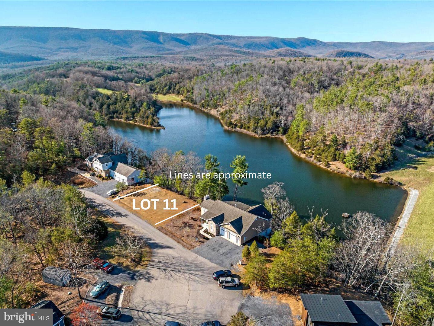 Discover the perfect canvas for your dream home at this exceptional Bryce Resort lakefront property! Cleared and ready for construction, this lot offers breathtaking views of both the mountains and serene Lake Carroll. Enjoy the freedom of a non-HOA property, combined with the convenience of public water and sewer services through Stoney Creek Water and Sewer—just a call and fee away to connect. With easy access off Resort Drive and a short walk to all the resort's amenities, this one-of-a-kind building lot promises unparalleled charm and convenience.
The resort area offers the following: small airport, library, dog park, indoor pool, outdoor pool, lazy river, pickleball, tennis, playground, 18 hole golf course, mini golf, lake, mountain biking, skiing, snowboarding, ice-skating rink, and restaurants, to name a few. 1.5 hours from NoVA. There is a farmers' market on Wednesdays during the summer. Call now for an appointment.