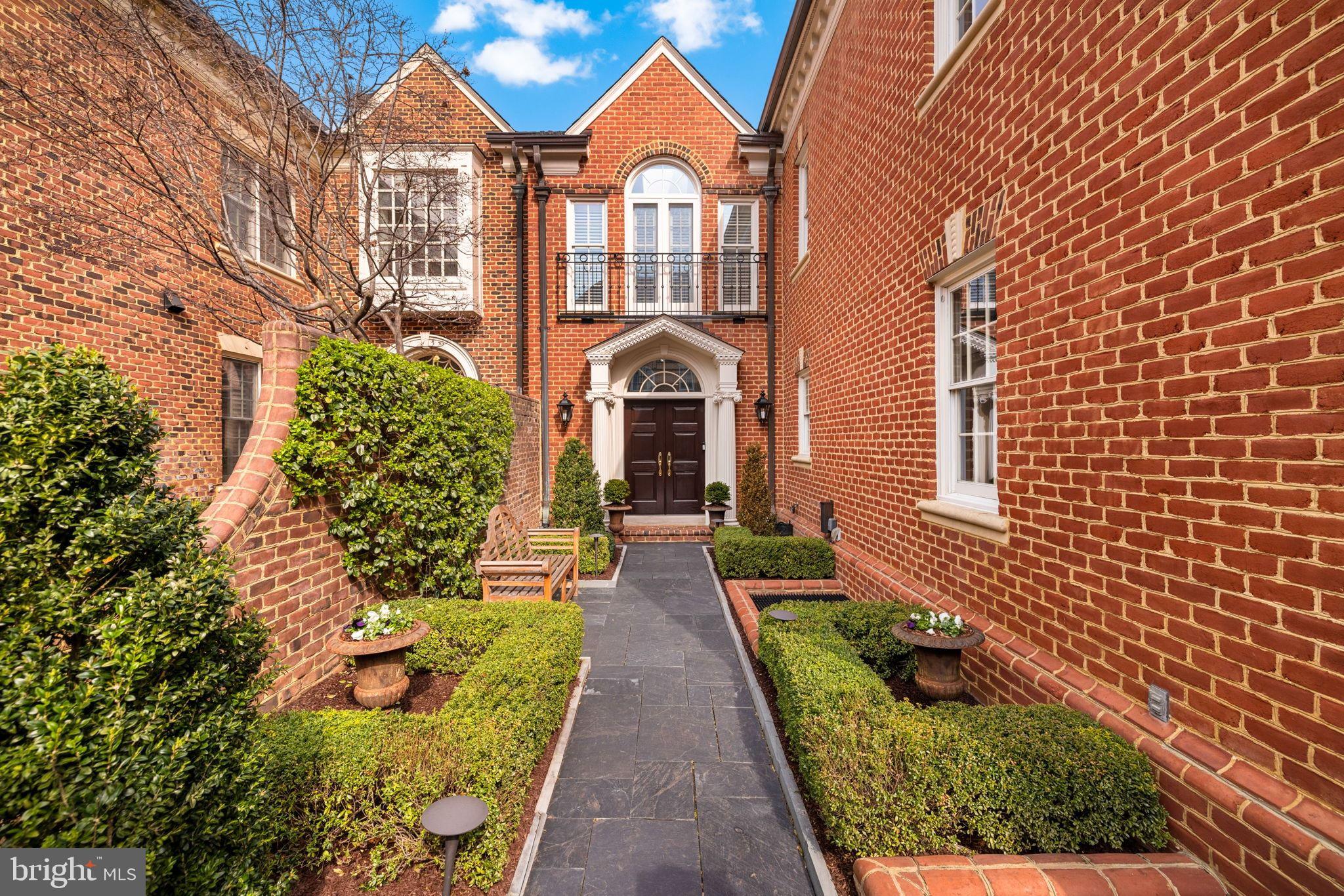 Best townhouse listing in McLean complete with generous outdoor spaces (courtyard/green space and balconies), lower level in law suite with separate entrance and kitchen large 2 car garage,  and garage sized storage unit.
A sought-after home in one of McLean’s most desirable neighborhoods, 1215 Stuart Robeson Drive is a unique Georgian-style brick residence constructed to exceptional scale, with high ceilings, incredible light and appealing flow across approximately 7,000 square feet of finished living space. This elegant home seamlessly meshes refined craftsmanship with modern livability.
A formal entry sequence ushers one into a dramatic two-story foyer, setting  the tone for the home’s generous proportions and high-quality finishes. The main level features a formal living room and dining room with custom built-ins, a fireplace, and large Palladian windows and French doors that open to a Juliet balcony. The space flows to an adjacent, relaxed family room. A chef’s kitchen is anchored by a large center island, custom cabinetry, premium appliances, and direct access to an expansive terrace.  There is an elevator that services three levels, and a discrete and elegant powder room.
The second level is anchored by an expansive primary suite, offering cathedral ceilings, a sitting area, a phenomenal walk-in closet with significant storage, and a spa-inspired primary bath flooded with natural light. Two additional well-proportioned bedrooms share a full bath. A conveniently located laundry room compliments the private living space. 
The lower level is designed for entertainment and flexibility, with a large room featuring light and complemented with a fireplace.  The level opens directly to a private, beautiful, and spacious Georgian-inspired brick patio. A full second kitchen, wine cellar, bonus rlarge garage sized storage unit.
A sought-after home in one of McLean’s most desirable neighborhoods, 1215 Stuart Robeson Drive is a unique Georgian-style brick residence constructed to exceptional scale, with high ceilings, incredible light and appealing flow across approximately 7,000 square feet of finished living space. This elegant home seamlessly meshes refined craftsmanship with modern livability.
A formal entry sequence ushers one into a dramatic two-story foyer, setting  the tone for the home’s generous proportions and high-quality finishes. The main level features a formal living room and dining room with custom built-ins, a fireplace, and large Palladian windows and French doors that open to a Juliet balcony. The space flows to an adjacent, relaxed family room. A chef’s kitchen is anchored by a large center island, custom cabinetry, premium appliances, and direct access to an expansive terrace.  There is an elevator that services three levels, and a discrete and elegant powder room.
The second level is anchored by an expansive primary suite, offering cathedral ceilings, a sitting area, a phenomenal walk-in closet with significant storage, and a spa-inspired primary bath flooded with natural light. Two additional well-proportioned bedrooms share a full bath. A conveniently located laundry room compliments the private living space. 
The lower level is designed for entertainment and flexibility, with a large room featuring light and complemented with a fireplace.  The level opens directly to a private, beautiful, and spacious Georgian-inspired brick patio. A full second kitchen, wine cellar, bonus room, large cedar closet, and an additional bedroom suite with a full bath - ideal for guests or extended stays - make up the rest of this expansive floor.
A large and open exercise room, and a bedroom with full bath enjoy the benefit of light from the well-placed skylights.  There is also significant attic storage on the top level. 
This home offers access measured in minutes to D.C., to both major airports and to the surrounding countryside.  It is also well-positioned near McLean’s shops, dining, and commuter routes.