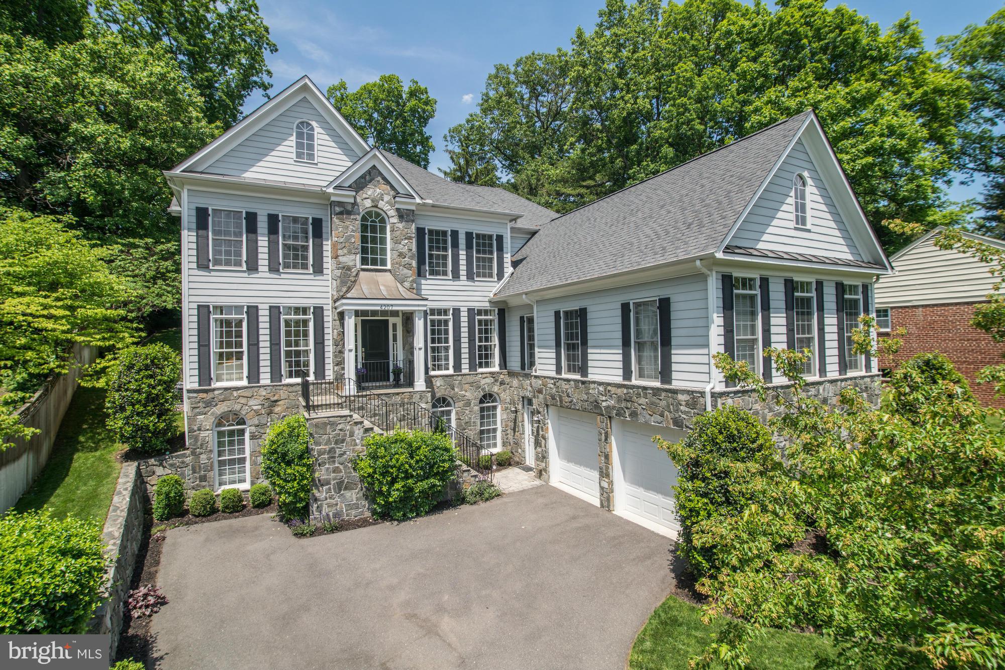 Stunning Custom built home by Sunline featuring 6 bedrooms (including separate in law/Aupair suite) and 5.5 bathrooms.  Open and sunny gourmet kitchen featuring custom granite, Wolf and Subzero.  2 car garage, private patio and great storage! Just minutes to schools   Taylor, Williamsburg and Yorktown - bike trails, WGCC, and DC! Private Main level in-law suite with kit, lr, dr, br and own HVAC.