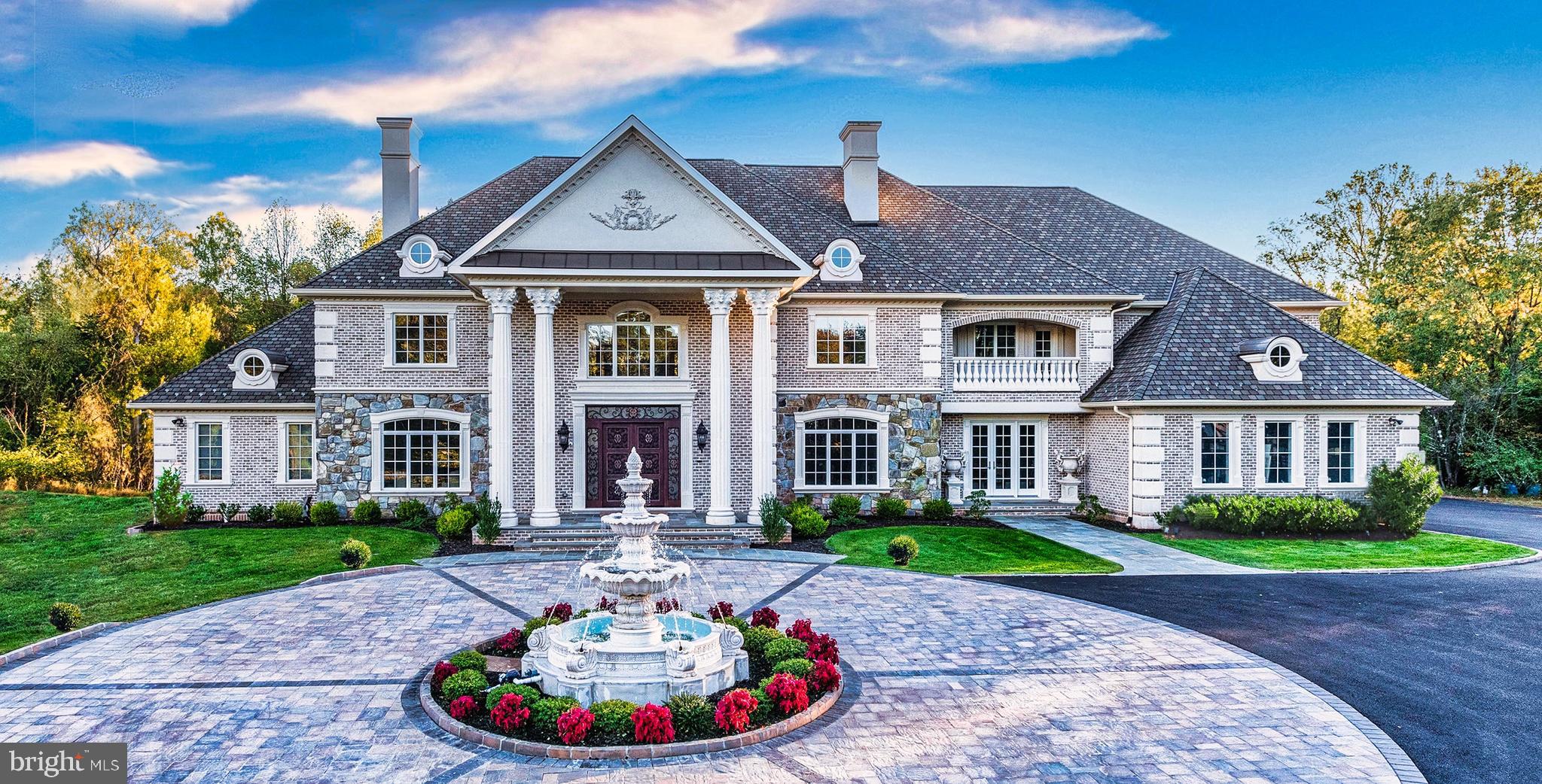 Once in a lifetime opportunity to own one of the finest estates in the greater Washington area. The magnificent Blue Ridge Manor is inspired by the finest European design and architecture, and offers unparalleled distinction and prominence. Discretely sited on a gated 5-acre lot in prestigious Great Falls, Virginia, this sublime 16,000 square foot resort-like estate offers exceptional luxury. 
Custom iron gates introduce a long-private driveway which leads to a private parking court and dramatic marble fountain. Stepping through the custom bronze doors, one is struck by both the grandeur of the home as well as the finest of details which are immediately evident. Hand-crafted plaster moldings, dazzling, custom made chandeliers and bespoke millwork reveal the unequivocal attention to detail this masterpiece holds. Over two years in the making, this sophisticated estate offers three kitchens, including a separate spice kitchen and large kitchen in the attached guest quarters, nine bedrooms, nine full baths and four half baths. The public rooms include an elegant formal living room and dining room, perfect for grand scale entertaining, as well as a stately library with coffered ceilings and custom bookcases. A true chef’s kitchen, complete with marble countertops and hand-crafted, custom cabinetry is handsomely complimented with a convenient breakfast area overlooking the serene, private backyard. The chef’s kitchen also opens to an inviting family room with soaring ceilings, a regal fireplace and French doors which lead to the outdoor stone balcony overlooking the exquisite setting and opulent pool. The main level also hosts a screening/media room, as well as an estate manager’s office with a separate entrance near the driveway for added convenience and privacy. 
Upstairs, the sumptuous private owner’s suite features a sitting room, an exquisite owner’s suite bath and separate dressing room, all designed to pamper every indulgence.
The bright, welcoming walk out lower level boasts a sprawling recreation room with a wine cellar and a fully appointed wet bar overlooking the uniquely private views of the backyard oasis. The list of luxurious amenities continues with a private spa complete with a sauna, fitness studio and massage room, as well as a gift-wrapping room. A separate, two level, two-bedroom guest quarters is located in an adjoining wing of the estate to provide added privacy. When you step outside this grand estate, you enter a world of your own. The beautiful grounds, both lush and private, are the perfect backdrop to this peaceful retreat. Amid the gardens and towering trees is an expansive space for entertaining, with a glittering pool with laser jet fountains, a waterfall and mesmerizing fire bowls, as well as a private putting green. 
Blue Ridge Manor is in a location that is convenient to the entire Washington area. Located just outside of Washington, DC and merely 10 minutes from the dynamic urban hub of Tysons Corner, 5 minutes to downtown Reston, and 15 minutes to Dulles airport. Blue Ridge Manor is truly a one-of-a-kind estate of global significance and one that cannot be duplicated. 
Shown by appointment.