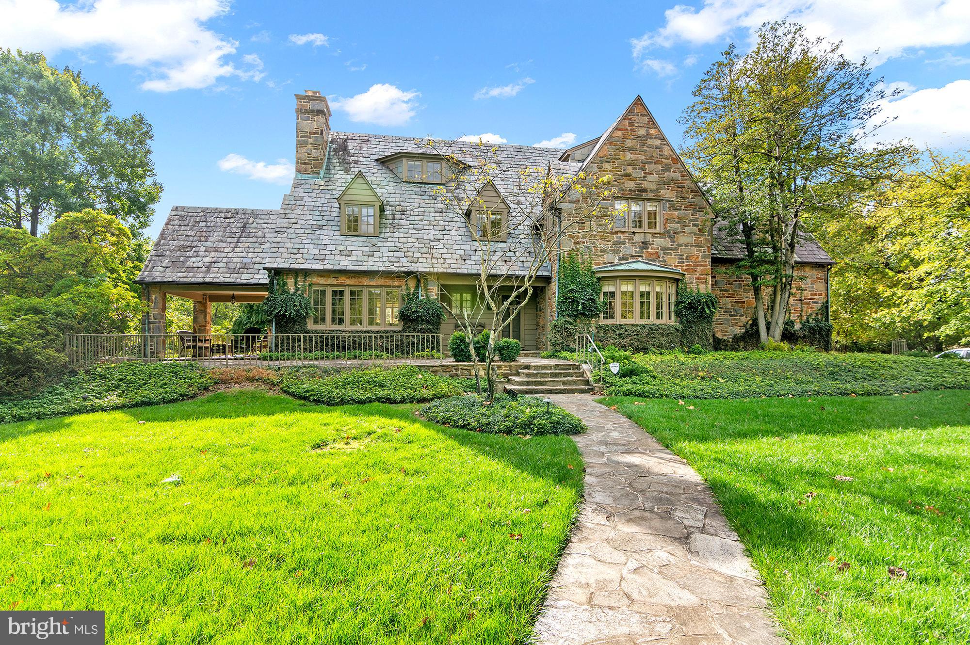 Discover this charming 6+ bedroom, 4.5-bath colonial home nestled in the heart of the prestigious Dumbarton Community. Situated on about an acre, this home boasts exceptional curb appeal with a wrap-around porch, spacious driveway, attached 2-car garage, and a large backyard deck perfect for entertaining.

Step inside to find a bright and inviting living room with an additional sitting area featuring built-ins and access to a covered porch. The formal dining room showcases a modern chandelier, while the quaint eat-in kitchen is equipped with updated appliances, a pantry, and an extra refrigerator, all opening onto the back deck overlooking a serene backyard oasis. Gleaming hardwood floors run throughout the home, adding warmth and elegance.

The second level features a primary bedroom suite with an additional room and en-suite bath. Three additional bedrooms, a hall bath and walk-in closet complete this level.

The third level offers even more space, including 2–3 additional bedrooms, a full bath, and extra storage space—perfect for a growing family or guest accommodations.

Perfectly located with convenient access to local amenities, this home combines style, space, and comfort in one outstanding package.