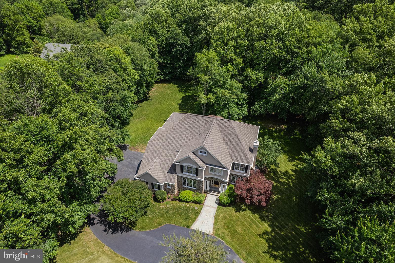 If you desire an exceptional residence with gracious curb appeal, privacy, a spectacular lot and exceptional schools, look no further, this is your home!  Get ready to enjoy your summer in this quality built Edgemoore home boasting more than 6,000 square feet of living space on nearly 2 acres that offers vaulted ceilings, walls of windows and captivating natural light.  This award winning layout is ideal for entertaining and everyday living.  You will enjoy it year round with flexible indoor and outdoor spaces including an inviting outdoor oasis complete with screened porch, deck, and a premium 1.83 acre flat lot that showcases beautiful nature and wildlife views and provides ultimate privacy!  Located in an exclusive enclave of semi-custom homes, this idyllic neighborhood feels like country living with large lots, plenty of green space, and friendly neighbors.  

<br>

You will be charmed by the stunning curb appeal of this English Manor styled 
elegant and gracious home with a stately stone facade, side load 3-car garage and expansive front lawn.  A stone pathway leads to an impressive portico that opens into the inviting foyer. The outstanding design of this home offers an exceptional open floor plan,  with every room providing views of nature, and the abundant natural light enhances the home's spacious feel, while the dramatic two-story great room serves as the centerpiece of the main level with a floor-to-ceiling fireplace.

<br>

The expansive kitchen is thoughtfully designed with a large center island, pantry, organization station, and sunny breakfast area that leads to the screened porch and deck perfect for outdoor dining, entertaining or simply to relax and enjoy  the tranquility of the surrounding landscape. Formal living and dining rooms offer elegant entertaining spaces for special occasions  or flexible rooms to suit today's more casual lifestyle, while a private main-level library provides the ideal work-from-home spot.

<br>

The upper level boast the desirable 4 bedroom and 3 full bath layout including a luxurious primary suite complete with a sitting room, cozy fireplace, dual walk-in closets, and a spa-inspired bath.  A spacious guest suite enjoys a private ensuite bath, while two additional generously sized bedrooms share a Jack-and-Jill bath.   All bedrooms have walk-in closets for optimum organization.

<br>

The walk-out lower level is designed for recreation and relaxation, featuring a fully equipped wet bar, game area with pool table that conveys, a fitness area, and a fifth bedroom with full bath - ideal for guests, multi-generational living, or an au pair suite.  Walk out to the huge, playable yard with plenty of space to add a pool should you desire.

<br>

This residence has it all and is located in the highly sought after Crossfield Elementary, Carson Middle and Oakton High School pyramid. It provides convenient access to major commuter routes - 50, 66 and 267, and minutes to the Dulles Airport, Silver Line Metro, shopping and restaurants at Reston Town Center, Tysons and Fairfax Corner. 

<br>

Extensive recent updates include:  Roof (2026), Whole House Paint (2026), Carpet and LVP Flooring (2026), Floor Refinishing (2026), Epoxy Garage Flooring (2026), HVACs (2026 & 2019), GE Profile Wall Ovens (2025), LG Washer/Dryer (2024), Bosch Dishwasher (2023), GE Refrigerator (2020).

<br>

Come experience 12361 Clareth Drive at open houses on Saturday and Sunday, June 6th and 7th from 2-4pm.