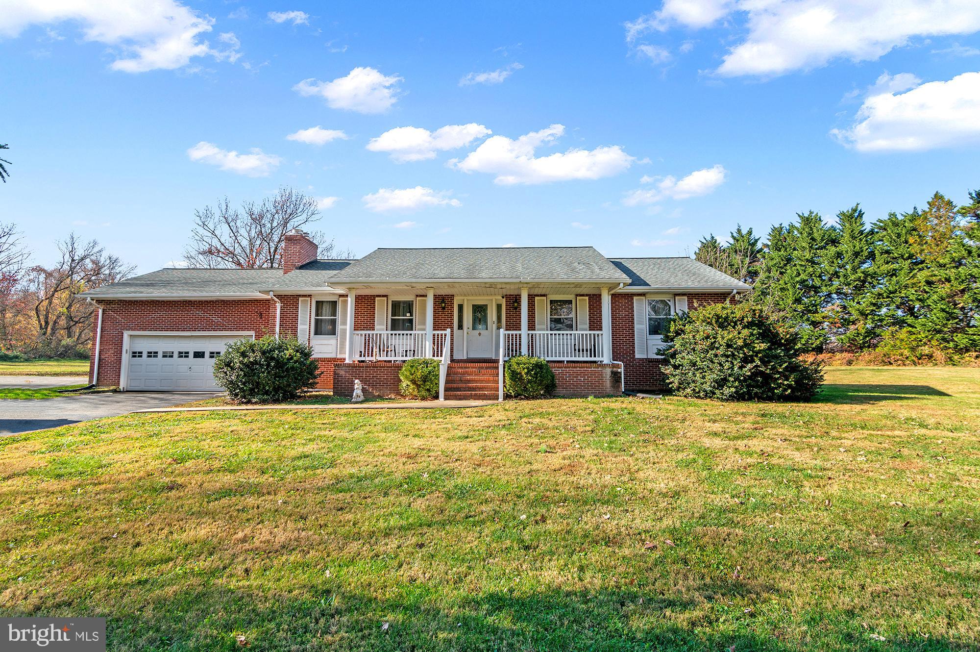 Don't let this one get away!!  Great New Price!!  This charming 3BR, 3BA rancher sits on an expansive 3.5 acre lot.  As you walk in, the foyer leads you into the living room and dining room with an open kitchen concept.  The unfinished basement is a blank canvas but could offer lots of additional space if you chose to finish it. This home has an attached garage, and there are 2 fireplaces in this home.
The front porch invites you to unwind and take in the scenic views. This property is the epitome of country charm, and perfect for those seeking space and privacy.
This home has great potential for buyers to put in their personal touch on creating their dream home.