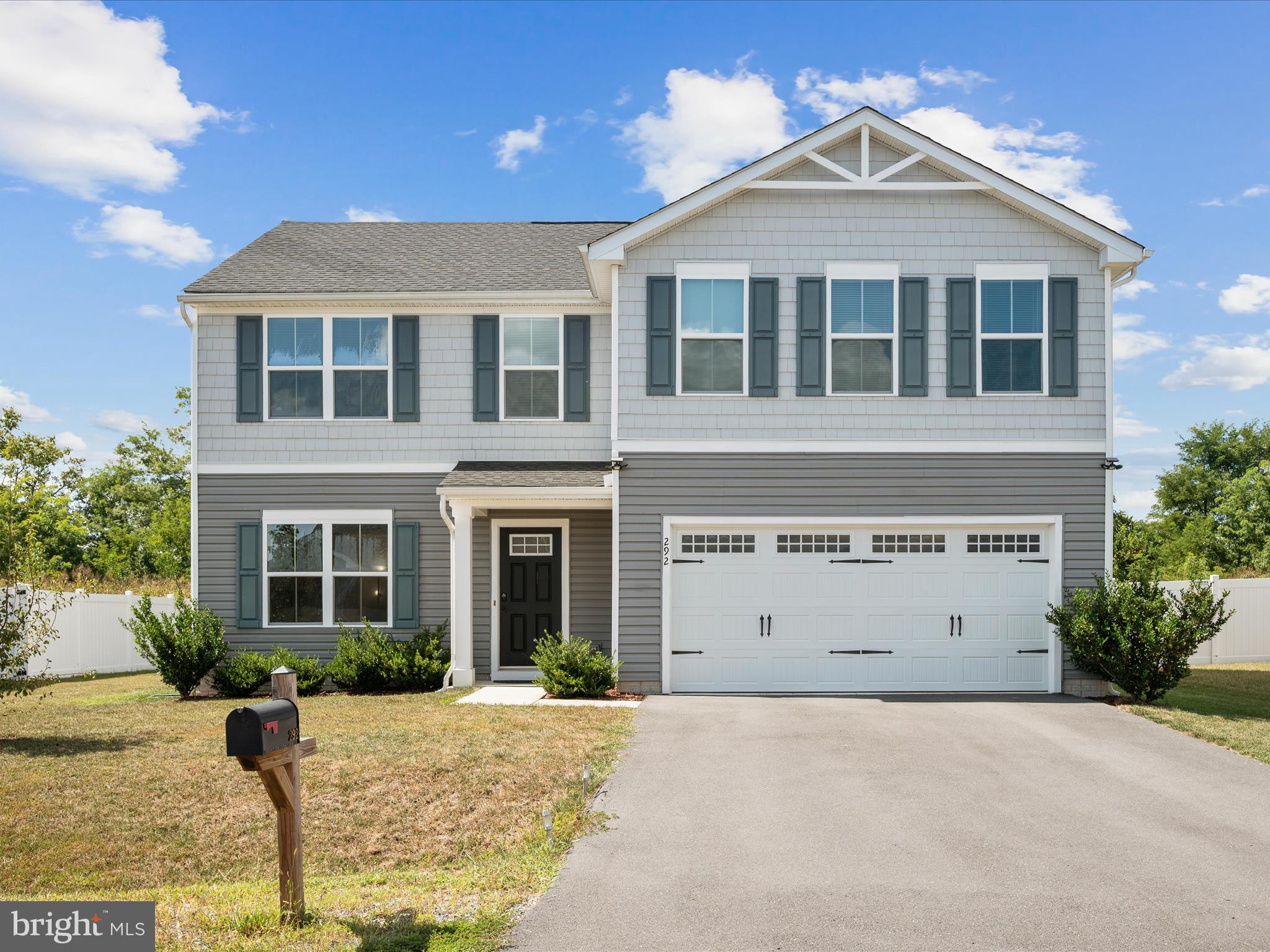Great opportunity to own this well-designed, four-year-young home in the Chandlers Glen Subdivision. Offering 4 bedrooms, 2.5 baths, and approximately 2,160 square feet of finished living space, this home features an open-concept layout perfect for modern living. The chef’s kitchen includes a large island bar and stainless steel appliances, flowing seamlessly into the main living areas. The spacious primary suite offers a private en-suite bath and walk-in closet. Additional highlights include a covered front porch, a two-car attached garage, paved driveway, and a large, partially fenced backyard with a covered pergola area that backs to a berm for added privacy. Conveniently located near I-81, Winchester, Martinsburg, and Northern Virginia.