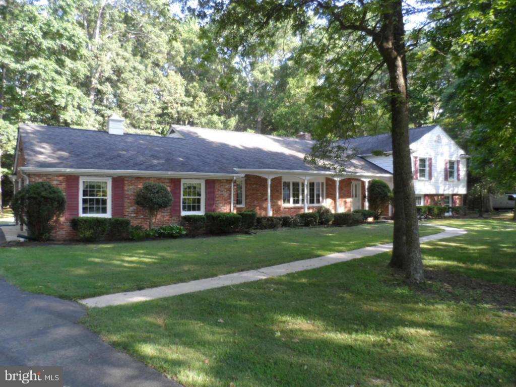 WOW..what a find ! 3100+ SQ Ft of immaculately clean house. All of the rooms are large including all 4 bedrooms > Even the 2 car garage is well oversized! All of this on 2 full acres of land and lots of peace and quiet  !! Entertain in the country kitchen or sit back in the family room and build a fire in the wood stove. Close to shopping, schools and church. A rare find in this condition. HURRY !