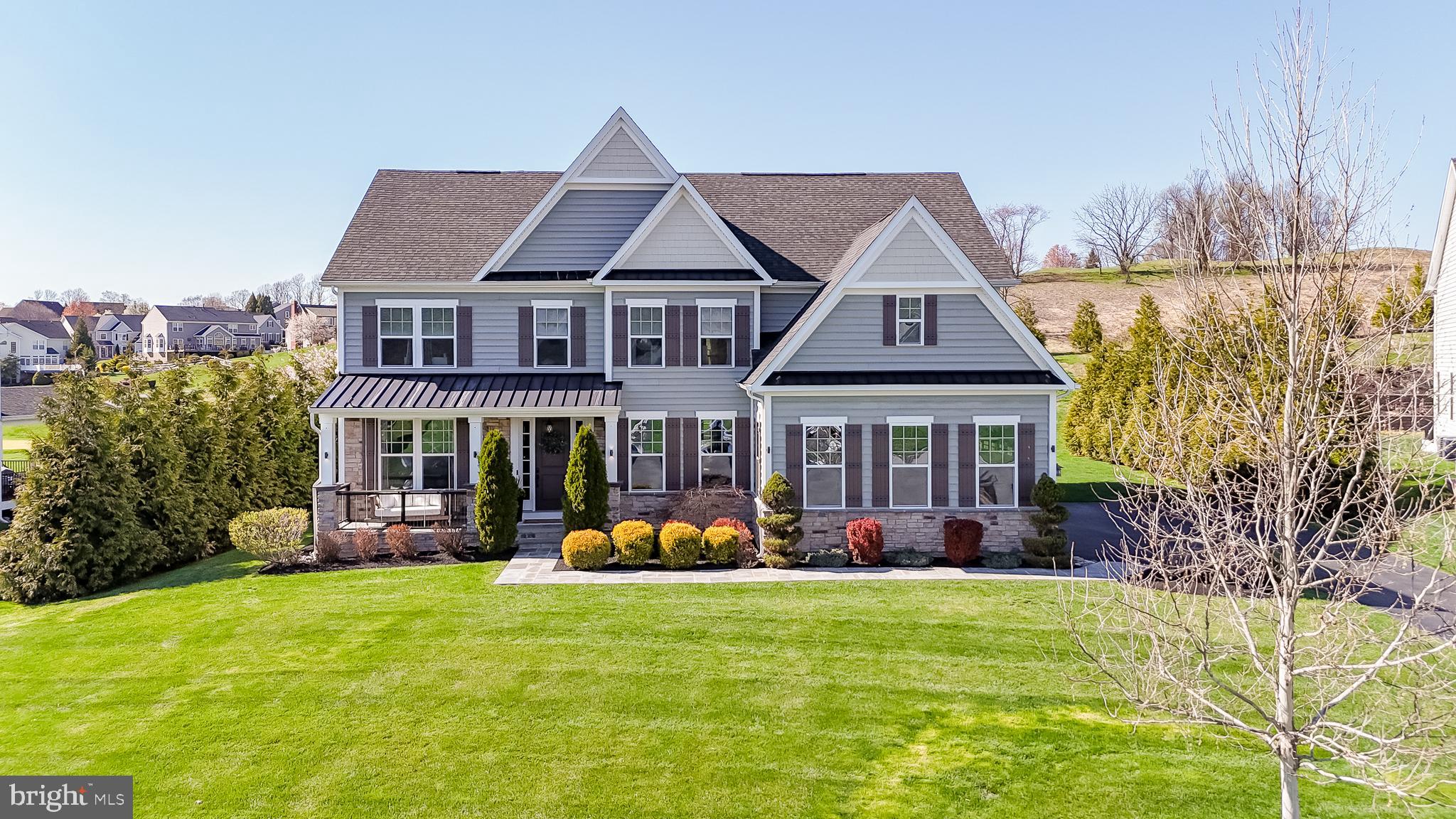 Welcome to 1524 Silverbark Lane in West Chester, PA—an exceptional executive residence that is truly a showstopper. Thoughtfully designed with impeccable attention to detail, this stunning home offers refined elegance, modern comfort, and an unbeatable setting along the Broad Run Golf Course, tucked quietly on a cul-de-sac.

A charming flagstone walkway leads to the inviting front porch, complete with a classic swing—perfect for enjoying peaceful mornings or evening sunsets. Step inside to a breathtaking foyer adorned with custom moldings that set the tone for the entire home. To the right, you’ll find a sophisticated formal dining room highlighted by exquisite woodwork, while French doors open to a private home office—ideal for today’s lifestyle.

The dramatic two-story family room features a striking gas fireplace and abundant natural light, seamlessly connecting to the heart of the home—the gourmet kitchen. Designed for both everyday living and entertaining, the kitchen boasts stainless steel appliances, a 5-burner gas cooktop, double ovens, a built-in microwave, and a spacious breakfast area. This level also offers a convenient mudroom, full bath, and a versatile bedroom—perfect for guests or multigenerational living.

Upstairs, the elegant staircase leads to the luxurious primary suite, complete with dual vanities, a freestanding soaking tub, and a glass-enclosed shower. The expansive walk-in closet provides exceptional storage space. Three additional generously sized bedrooms, two full bathrooms, and a well-appointed laundry room complete this level.

The finished lower level is designed for both relaxation and recreation, featuring a playroom, game room,  movie space, full bathroom, and a newly finished home gym.

Step outside to your private outdoor oasis—an entertainer’s dream. Enjoy the covered deck with TV, a beautifully designed stone patio with turf, and a custom stone wall featuring a fireplace, grill, and griddle—perfect for hosting gatherings year-round.  The side entry 2 car garage provides convenient access to the mud room.  All the garage cabinet storage can easily be moved to the basement storage room as well. 

This extraordinary home is a true masterpiece—meticulously maintained and completely move-in ready.