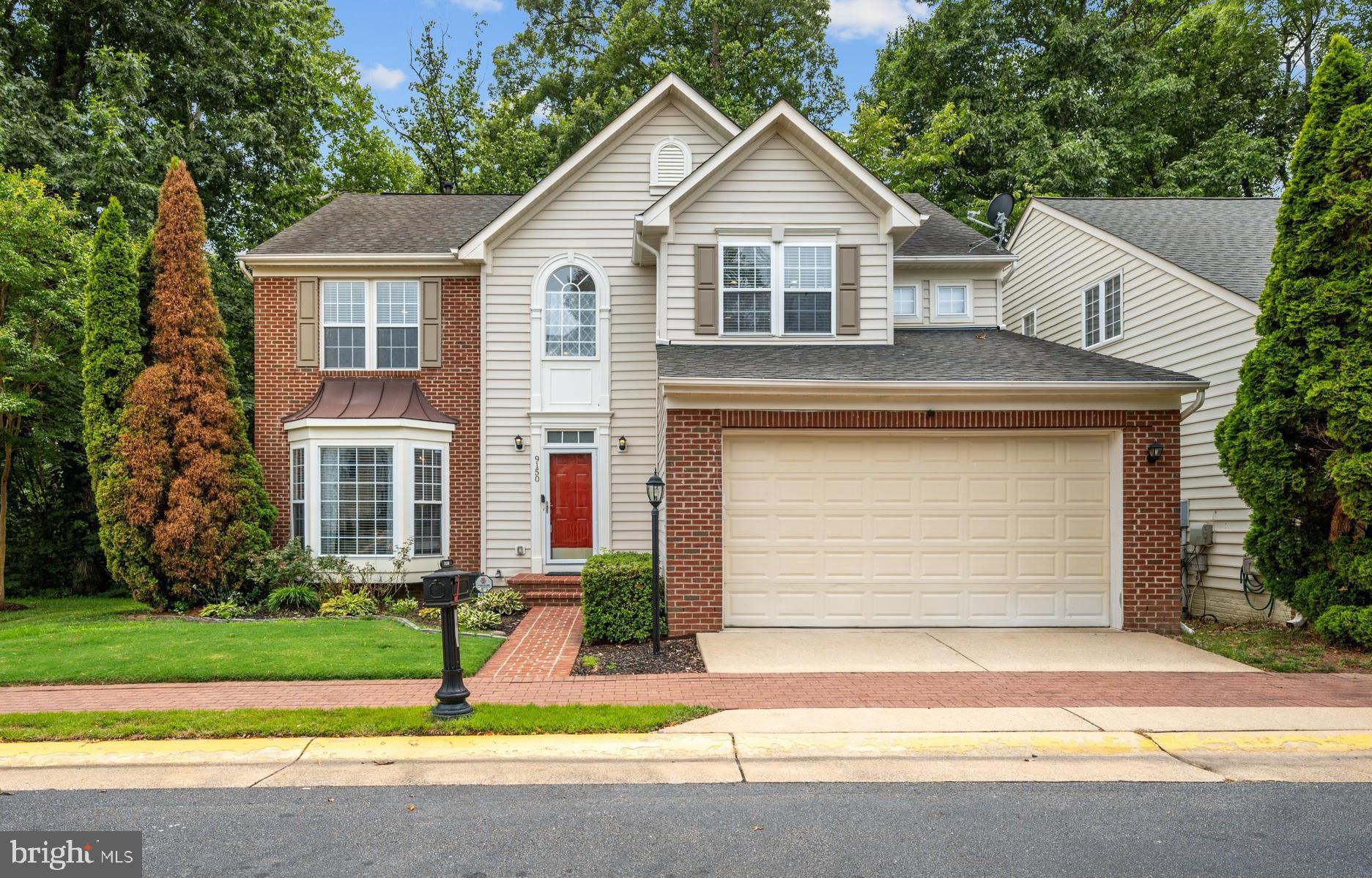 Welcome home to Lorton Station! This impressive 3-level home greets you with a dramatic two-story foyer and a palladium window that fills the space with natural light. Gleaming hardwood floors flow throughout the main level, leading into a gourmet kitchen showcasing rich 42-inch cherry cabinets, sleek granite countertops, and stainless steel appliances, all opening effortlessly to a sunny breakfast nook perfect for casual dining. Just off the foyer on the other side of the kitchen, a formal dining room adorned with sophisticated crown molding sets an elegant stage for entertaining. The kitchen flows seamlessly into an inviting family room, warmed by a cozy gas fireplace and made for comfortable everyday living, while French doors lead to a dedicated home office just beyond. Upstairs, the primary suite offers a true retreat, complete with a private sitting area, spacious walk-in closet, and an en suite bathroom featuring a wide double sink vanity, frameless step-in shower, and soothing soaking tub. Three additional bedrooms and a second full bathroom complete the upper level, each offering soft, plush carpeting for added comfort. Downstairs on the lower level, a spacious recreation room awaits alongside a fifth bedroom, ideal as a home office, guest space, or whatever suits your needs, plus a third full bathroom for added convenience. A generously-sized storage room rounds out this level of the home. Step outside to a deck off the main level, enveloped by large mature trees that create a serene, private backdrop for relaxing or entertaining. The front of the home offers a 2-car garage, plus additional community and visitor parking. Additional home updates include a newer HVAC (2022), water heater (2018), attic and basement insulation, plus modern light fixtures and finishes throughout. Residents enjoy resort-like amenities including two community pools, a clubhouse, tennis and basketball courts, playgrounds, scenic jogging paths, and beautifully maintained common grounds. Just minutes to Food Lion, Wegmans, Springfield Town Center, Workhouse Arts Center, Burke Lake Park, Occoquan Regional Park, and Fort Belvoir. Quick access to VRE Lorton Station, Franconia-Springfield Metro, Route 1, I-95, I-495, and the Fairfax County Parkway. Schedule a private tour of your beautiful new home today!