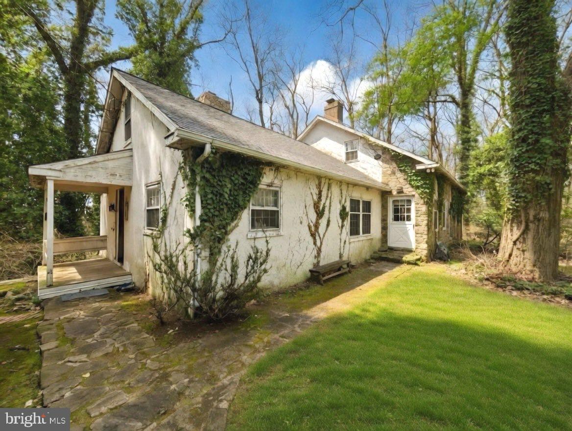 Nestled in the heart of sought-after Birchrunville in Chester Springs, this exceptional property offers a rare blend of timeless charm, serene countryside living, and endless potential. Set on two parcels totaling 18 acres (7.5 acres and 10.6 acres), the property provides both a private homesite and a picturesque pasture just across the street—perfect for equestrian use or simply enjoying the beauty of open land.  The home was thoughtfully designed to capture the character of an older farmhouse, featuring warm, inviting spaces and classic architectural details throughout. The main level offers a spacious kitchen with a large pantry and a pass-through to the eating area, a formal dining room, and a cozy living room highlighted by a stunning stone fireplace. An additional living room with its own fireplace and access to the porch creates the perfect setting for relaxing or entertaining. A private office or library and a convenient half bath complete the first floor.
Upstairs, the second floor offers a main bedroom with a full bath, along with two additional bedrooms and another full bath. There is also an unfinished space that presents a great opportunity—perfectly suited for a future playroom, studio, or home office if finished.  Outside, the property continues to impress with a 4-stall barn and a 5-bay open garage, making it ideal for hobbyists, car enthusiasts, or those seeking a functional equestrian setup.  While the home maintains its original charm, it offers an incredible opportunity for updates and customization. With its expansive acreage, multiple parcels, and highly desirable location, this is a truly special offering with endless possibilities.