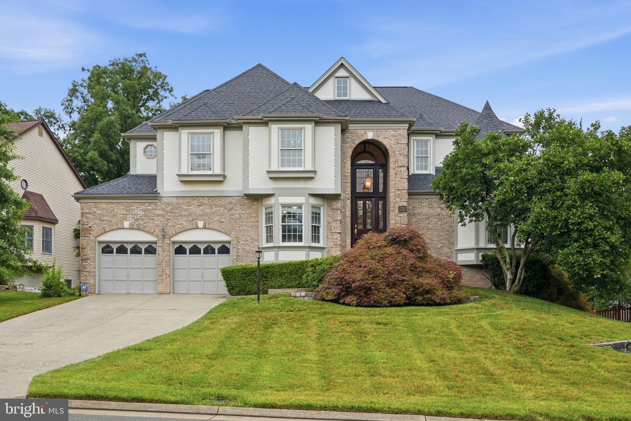 Welcome to this exceptional brick-front colonial, gracefully sited on a quiet cul-de-sac in the highly sought-after Ashburn Farm community. Offering approximately 5,000 square feet of beautifully updated living space across three finished levels, this remarkable residence combines timeless elegance, thoughtful updates, and an outstanding location within the highly acclaimed Stone Bridge High School pyramid.

From the moment you step inside through the dual-height leaded glass front entrance, the dramatic two-story foyer creates a memorable first impression. Rich hardwood flooring, luxury carpeting, fresh interior paint, abundant natural light, and sophisticated architectural details enhance every level of the home.

Designed for both everyday living and elegant entertaining, the main level features formal living and dining rooms, a spectacular family room anchored by a welcoming fireplace framed by hardwood architectural paneling, and an executive library with custom built-in cabinetry, rich wood paneling — an ideal space for working from home. The spacious gourmet kitchen is a chef's dream, featuring custom cabinetry, premium stainless steel appliances including a dual oven, generous counter space, a large center island, and a sun-filled dining area. The large walk-in pantry includes a conveniently located full-size vertical freezer.

Just beyond, the expansive rear deck and large gazebo create a seamless indoor-outdoor living experience overlooking the beautifully landscaped, fully fenced backyard surrounded by mature trees. A powder room, spacious laundry room, and oversized two-car garage complete the main level. The spacious laundry room includes a washer, gas dryer, and ample cabinets.

The upper level is highlighted by an impressive primary suite that serves as a true private retreat, featuring soaring vaulted ceilings, a spacious sitting room, a cozy fireplace, a luxurious en-suite bath and multiple walk-in and cedar-lined closets. Three additional, generously sized bedrooms and two additional full bathrooms provide exceptional comfort and flexibility for family members and guests.

The fully finished walk-out lower level offers remarkable versatility with a large recreation room with a third gas fireplace, two additional bedrooms, full bathroom with dual vanity, home gym or second office, and generous storage - perfect for extended family, entertaining, or multi-generational living. The recreation room provides seamless access to a second spacious deck with its own large gazebo. A standalone storage shed is discretely positioned behind a privacy screen.

Recent improvements provide lasting value and peace of mind, including fresh interior paint, refinished decks and just completed professional cleaning throughout.

Outside, the private backyard oasis offers mature landscaping, expansive entertaining spaces, and exceptional privacy rarely found in Ashburn Farm.

Ideally located just minutes from Ashburn’s premier shopping, dining, entertainment; One Loudoun; Route 7, Route 28, the Dulles Greenway, Silver Line Metro; Dulles International Airport; Leesburg and Tysons Corner this extraordinary home delivers the perfect combination of luxury, comfort, convenience, and lifestyle in one of Loudoun County's most desirable communities.

Please see the Documents section of this listing for a description of the many recreational facilities and opportunities in the Ashburn community!
