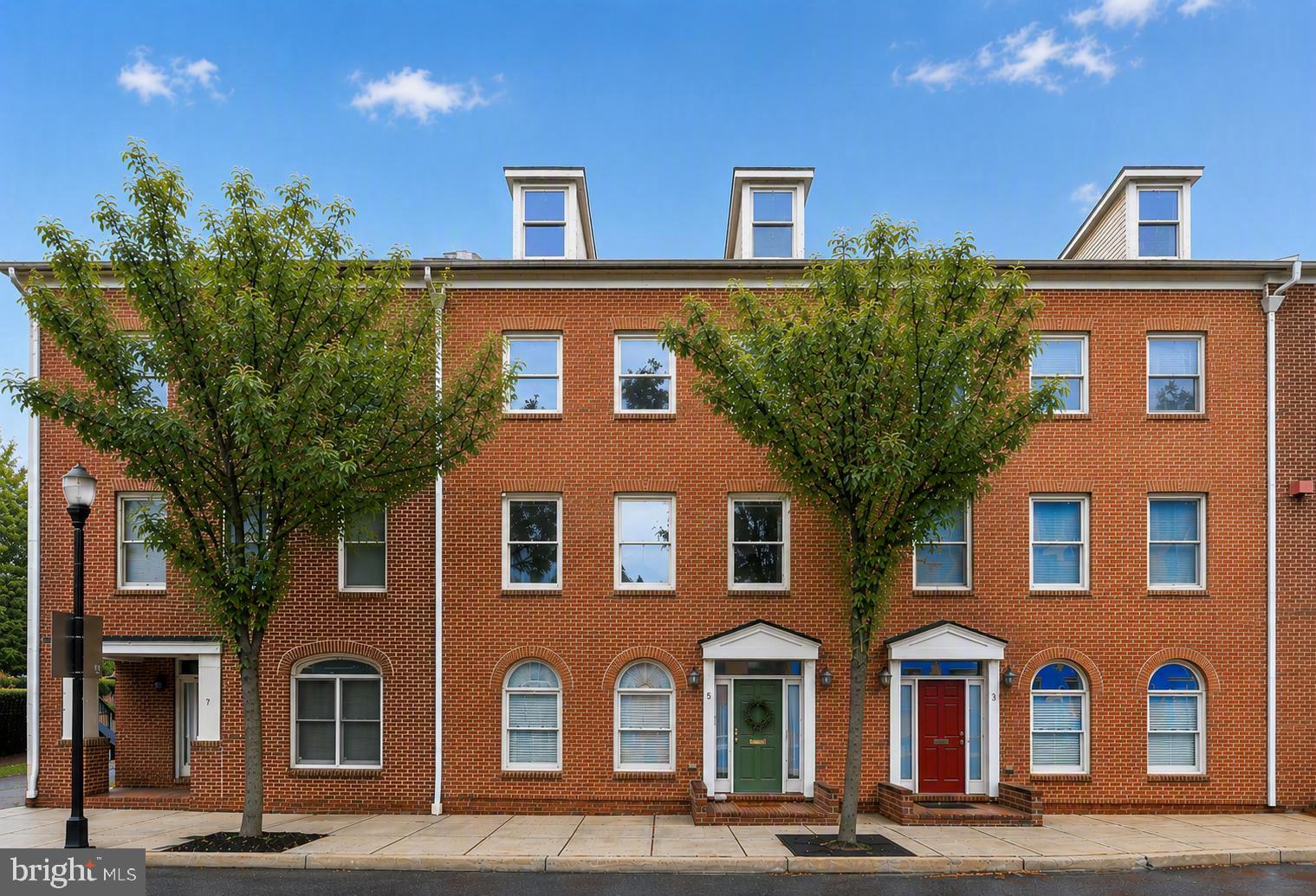 Live where everyone wants to be. Welcome to this beautifully appointed brick townhouse-style condominium in the heart of Downtown Frederick, where the city’s best restaurants, boutique shopping, coffee shops, breweries, Carroll Creek, and year-round events are all just steps from your front door.

One of the standout features? TWO covered carport PARKING spaces—a true luxury in downtown living.

Inside, you’ll find a thoughtfully designed floor plan with three spacious bedrooms, each featuring its own private full bath. The primary suite is a true retreat, complete with an en suite bath and two walk-in closets. The fully finished lower level expands your living space with a versatile recreation room, stylish bar area, bonus flex space perfect for a home office, gym, or media room, and a convenient half bath.

Enjoy the convenience of two separate laundry areas, offering added flexibility for everyday living, guests, or multi-generational needs.

Enjoy the timeless appeal of brick construction paired with the ease of low-maintenance condominium living, giving you more time to experience everything Downtown Frederick has to offer.

Whether you’re meeting friends for dinner, enjoying a stroll along Carroll Creek, or experiencing Frederick’s vibrant festivals and events, this home puts you at the center of it all. Opportunities like this are rare—a spacious home with covered parking for two vehicles, an exceptional layout, and an unbeatable downtown location. Schedule your private tour today and experience for yourself why this is one of Downtown Frederick’s most desirable places to call home!