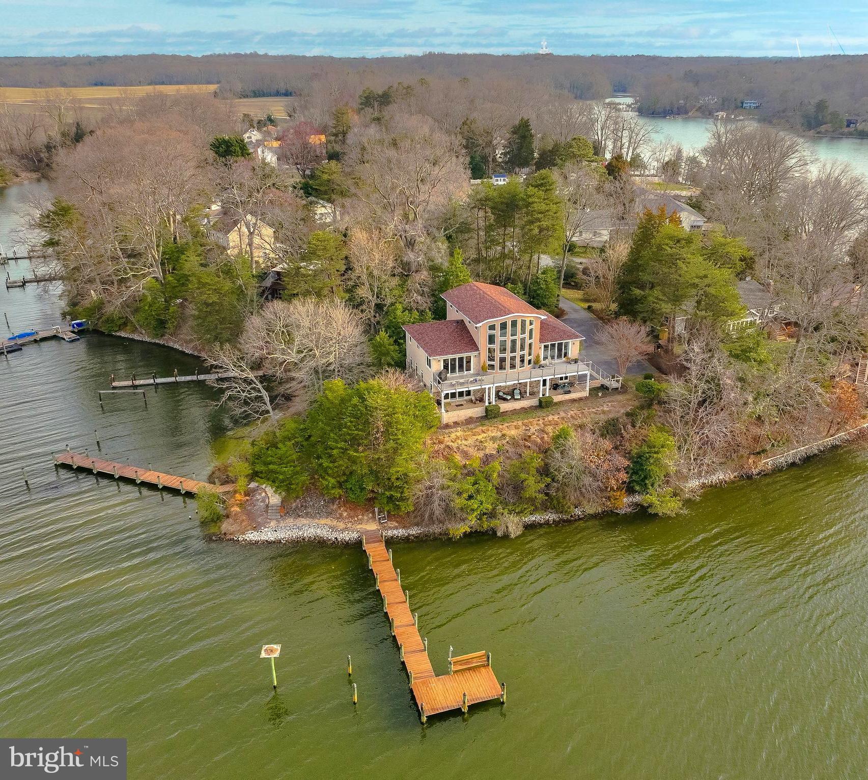 Enjoy Stunning views of Helen  Creek and the Patuxent River.  The property is a boaters dream with two  80 ft  private piers.
 Attention to detail is shown in this custom built home featuring countless upgrades. 
 A Gourmet Kitchen featuring Cherry Cabinets with Olive Ash Burl panels, Granite countertops, Dacor Stainless steel dual fuel range, Sub Zero Refrigerator, Wine Cooler, Freezer drawers, Icemaker and a Bosch dishwasher. 
African Cedar flooring through out the home. The  Primary bedroom leads to the deck overlooking the water.  Large Primary Bath with walk-in shower, double vanity and soaking tub. 
The Great room boasts expansive water views and a barrel ceiling. Relax in the loft while watching the Osprey and other wildlife. Entertain your guests at the first floor bar.  Catch your own Blue Crabs and fish off the piers.  Plenty of room to add another bedroom in loft or in  the basement.