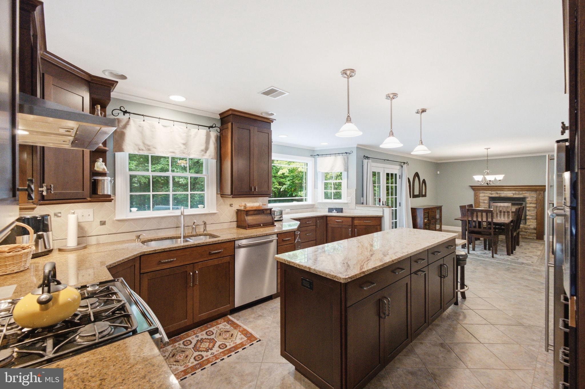 Welcome to 3 Theresa Lane, a beautifully maintained 4-bedroom, 2.5-bath Colonial situated on a private 1-acre cul-de-sac lot in desirable Saylorsburg. Featuring a whole-house generator, a roof replaced just 3 years ago, and a finished lower level, this move-in-ready home offers the perfect combination of comfort, space, and peace of mind. The main level features hardwood flooring, a spacious living room, and an expansive kitchen with abundant cabinetry, breakfast bar seating, pendant lighting, wall oven, and ample prep space. The adjoining dining area showcases a stunning stone fireplace and provides direct access to the oversized rear deck, ideal for entertaining. A versatile bonus room offers endless possibilities as a home office, playroom, or additional living space. A convenient half bath completes the level. Upstairs, the primary suite includes a walk-in closet and private bath with a soaking tub and oversized shower. Three additional bedrooms and a full bath provide plenty of room for family and guests. The lower level features a large recreation area, wet bar, storage room, and separate laundry area. Outside, enjoy the beautifully landscaped yard, expansive deck, utility shed, attached garage, and private driveway. Conveniently located near shopping, dining, outdoor recreation, and major commuter routes, this exceptional property offers the best of Pocono living.