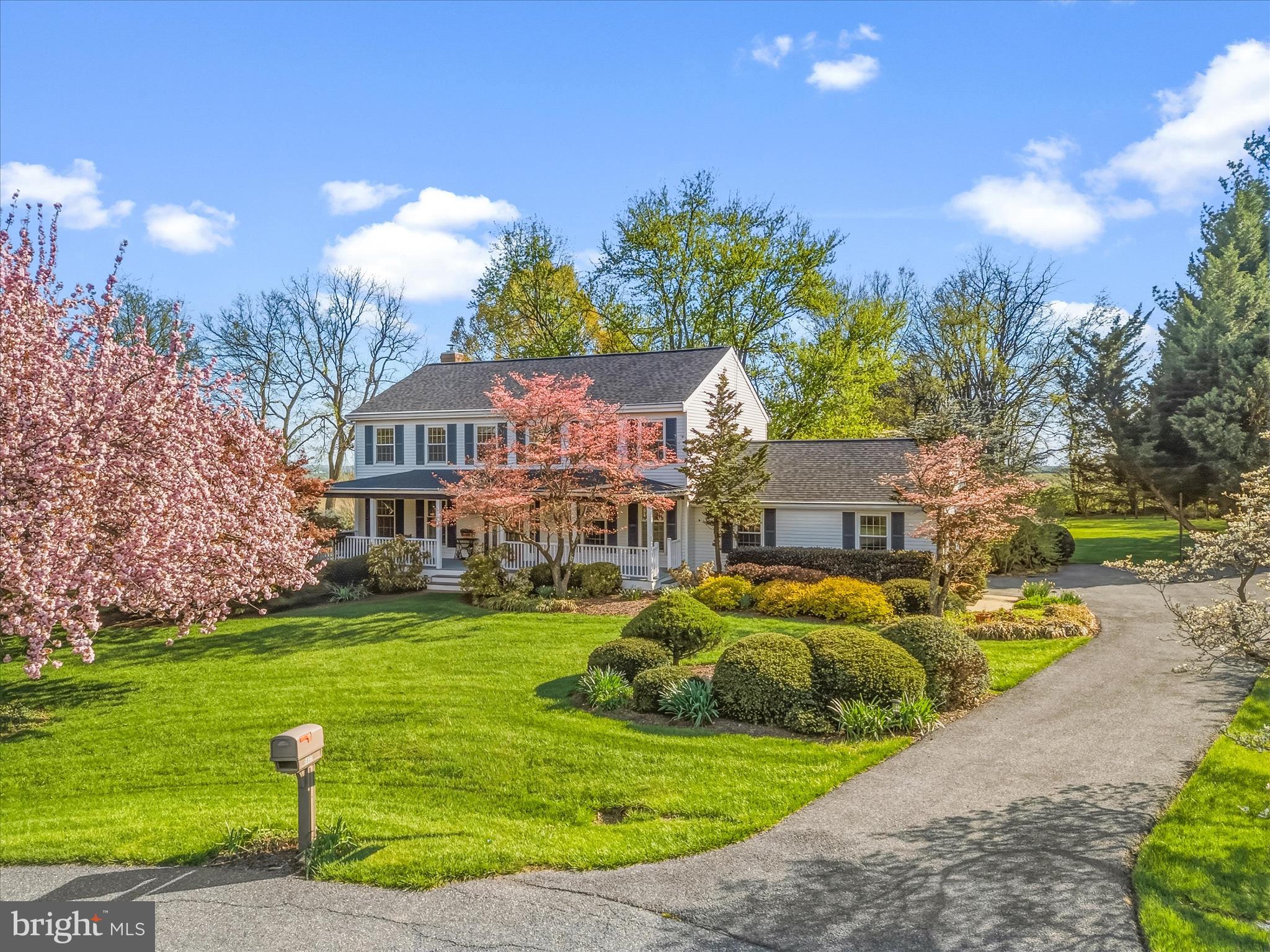 This home is situated on a peaceful cul-de-sac in the serene countryside of southern Frederick County—perfect for commuters and just minutes from downtown, with no city taxes. The lot backs to open farmland, offering breathtaking sunrises and stunning views of Sugarloaf Mountain.

The charming front porch, beautiful gardens, large rear deck, and expansive flat yard (just over an acre) create an idyllic outdoor retreat. One of the sellers’ favorite features has always been the fully fenced garden with ten raised beds, along with a mature grapevine and productive pear tree—offering a rare opportunity to enjoy your own homegrown harvest season after season. A convenient storage shed is ideally positioned nearby, making it easy to keep tools and supplies right where you need them.

Inside, you’ll find hardwood floors, a spacious kitchen with ample counter space, an expansive family room, first-floor laundry, and a convenient half bath. Upstairs offers four generously sized bedrooms and three full baths, providing plenty of room to spread out.

The finished basement features a rec room, flexible office space, and abundant storage. A side-load garage complements the 2,352 square feet above grade, plus approximately 600 finished square feet below.

Vinyl replacement windows by Simonton, a roof replaced prior to 2016 (before solar panel installation), a hot water heater (2021), water tank and conditioner (2022), a 2024 HVAC system, solar panels, and a cozy wood stove insert in the fireplace all contribute to comfort and efficiency.

Lovingly maintained and ready for its next chapter, this is the kind of home that offers both everyday ease and a setting you simply can’t recreate.