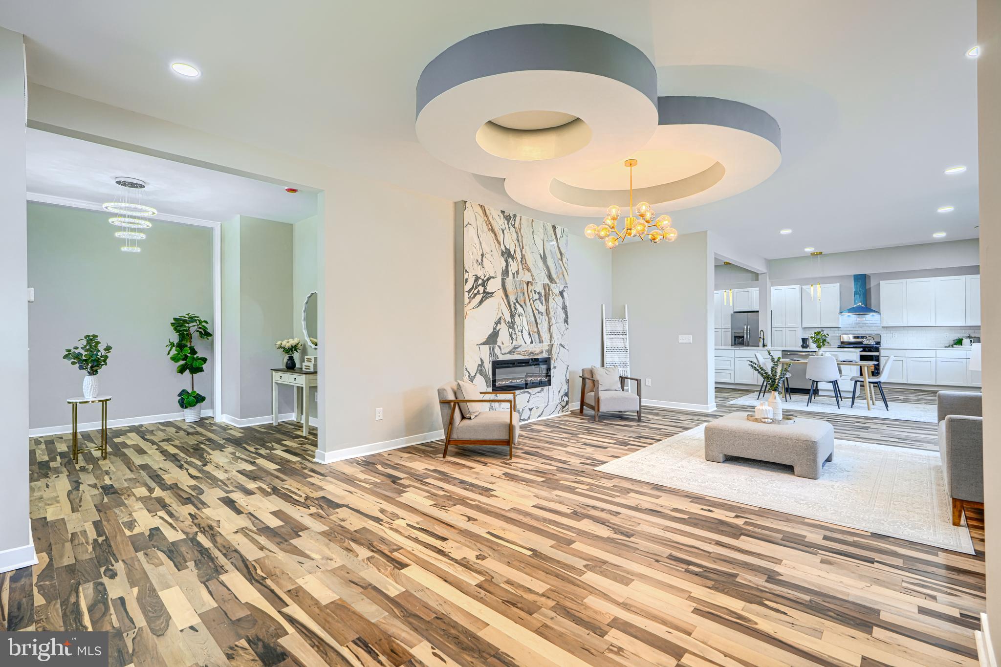 PRICELESS SHOWING: Almost‑Brand‑New Luxury in a Quiet Neighborhood

*Welcome to this 6‑bed, 5‑bath corner‑lot stunner*—everything above the basement (joists, walls, roof) is brand‑new. Open‑concept first floor flows living → dining → kitchen with modern ceiling detail, chandelier, fireplace, and hardwood throughout. The new kitchen shines with custom cabinets, granite island, and stainless appliances.

Upstairs: *two master suites* (yes, two), each with private bath. Bathrooms feature modern floating sinks (double sinks in the masters), *gorgeous ceramic tile* from floor to shower, and clean‑line fixtures. Main master adds a huge walk‑in closet, separate porch, freestanding tub, and dedicated laundry. Second floor also gets luxury vinyl, abundant closets, and its own central HVAC zone.

Finished basement includes bedroom + bath with the same upscale sink/tile finish—ideal guest/in‑law suite. Extras: huge driveway, front porch, massive yard on both street sides, close to shops.

*Total*: 6BR / 5BA, modern finishes, new systems, bright & quiet block.  
Come see it—this one shows like a model home.