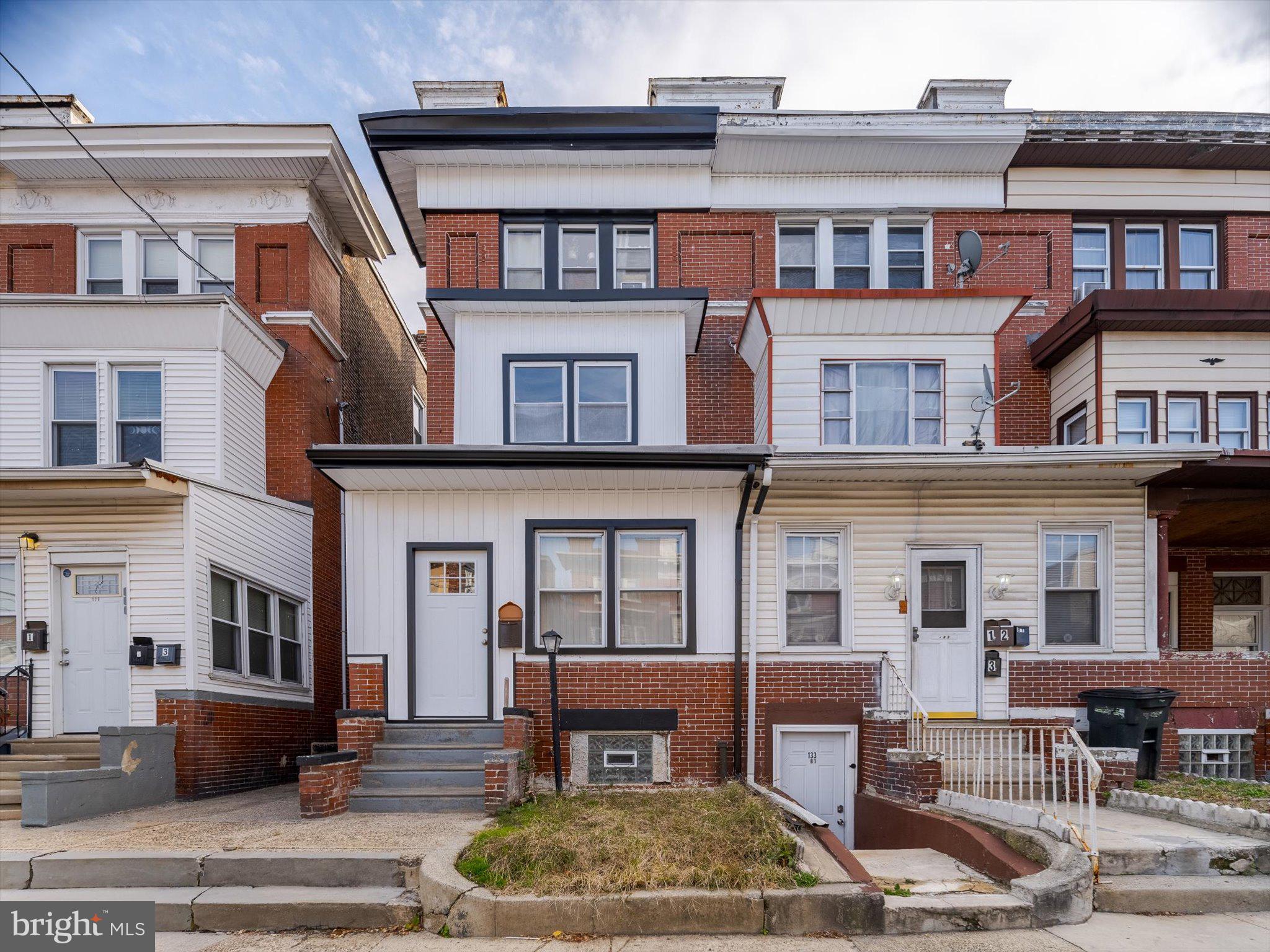 Welcome to 131 South 50th Street! This spacious, beautifully maintained 7-bedroom, 2-bath, twin home sits in the heart of Walnut Hill near University City, one of West Philadelphia’s most vibrant and convenient neighborhoods. Full of character and charm, it offers generous indoor and outdoor space in a highly bikeable, walkable location with easy access to public transit. Step inside through the enclosed porch into a bright, inviting living area featuring original hardwood floors, large windows, and an open, airy layout filled with natural light. The updated kitchen includes granite countertops and modern cabinetry—perfect for everyday cooking or entertaining. A main-level bedroom adds flexibility for guests, a home office, or additional living space. The second floor features three spacious bedrooms with ample closets and a refreshed full bathroom. The third floor provides two more bedrooms and a second full bath, creating plenty of room for anyone needing extra space. Outside, the large, private backyard is ideal for gardening, barbecues, or relaxing outdoors. A full, unfinished basement offers abundant storage or potential for future customization. Just minutes from University City, this home is close to Drexel University, the University of Pennsylvania, and the Penn Medicine campus. Everyday conveniences like the post office, YMCA, and the library are nearby, along with popular destinations including Clark Park, Baltimore Avenue, and 52nd Street. Transportation is a breeze with bus routes and the Market-Frankford Line only a short walk away, providing quick access to Center City. Offering comfort, convenience, and opportunity in a sought-after location, this home is one you won’t want to miss. Schedule your showing today!
