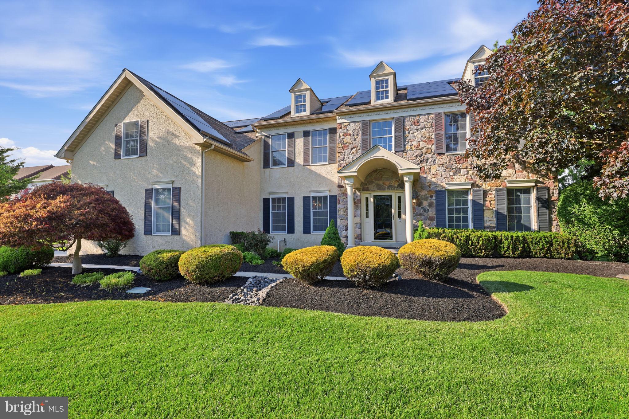 LOCATION, LOCATION, LOCATION! Set on a premium 1.2-acre lot in the highly sought-after Dolington Estates community of Lower Makefield Township, this exceptional 4,450 square foot home offers a rare combination of space, comfort, and breathtaking natural surroundings. Backing to 68+ ACRES OF PRESERVED FARMLAND, the property provides unmatched privacy and sweeping protected open panoramic views and is a short walk to  the Garden of Reflection.   A grand two-story center hall welcomes you and showcases 9-foot ceilings and hardwood flooring throughout the main level. The thoughtfully designed floor plan is ideal for everyday living and entertaining, with freshly painted living and dining rooms filled with natural light. The dramatic two-story family room features a floor-to-ceiling stone fireplace and flows seamlessly into the expansive kitchen. The kitchen is designed for both function and gathering, offering a 7-foot center island, granite countertops, 42-inch cabinetry, five year new appliances, gas cooking with downdraft venting to exterior,  double oven, tile backsplash, a spacious dining area, and a convenient rear staircase to the upper level.  A standout feature of the home is the stunning Solarium with vaulted ceiling and skylights, surrounded by walls of windows and perfect for everyday dining, morning coffee, or simply relaxing while enjoying peaceful views of the backyard. A private main-level office with custom built-ins provides an ideal work-from-home space. Upstairs are four generously sized bedrooms and three full baths, including a well-appointed owner’s suite with sitting room, enormous walk-in closet, and ensuite bath with separate vanities, soaking tub, and shower. A princess suite includes a private bath, while two additional freshly painted bedrooms share a Jack and Jill bath. The finished basement adds  over 1250 additional  sq, ft. of exceptional flexibility and a fully equipped gym, fourth full bath, recreation and gaming area, along with abundant storage. Step outside to a beautifully landscaped backyard designed for both relaxation and entertaining, featuring a spacious deck and patio overlooking a heated in-ground pool and bubbling hot tub! Whether hosting summer gatherings, enjoying quiet mornings, or unwinding at the end of the day, this private outdoor setting offers a true retreat surrounded by preserved land and natural beauty.  Additional upgrades include a NEW roof and skylights (2022), owned solar panels (2023) with potential  for net zero energy costs, and a two-zone HVAC system and transferrable home warranty. A 3-car side entry garage completes this home! Located within the highly regarded Pennsbury School District and offering convenient access to I-295, Princeton, Philadelphia and New York, as well as Yardley, Newtown, and Washington Crossing and the charming river towns along the Delaware! This is a rare opportunity to own a truly special, and rare,  Bucks County property.