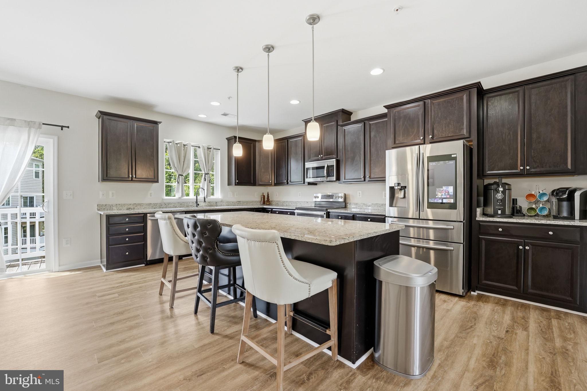 Home is the Address. Stonebridge is the Lifestyle. Step outside the front door and within minutes you are at Stonebridge at Potomac Town Center — Wegmans, Alamo, Not Your Average Joes and other acclaimed restaurants, fitness, and retail all in one destination. This is not a perk you discover after moving in. It is the rhythm of daily life here. Inside, this Stanley Martin-built condominium delivers over 2,300 square feet across two well-designed levels — more space than most buyers expect at this price point in Woodbridge. The open main level flows from a generous living and dining area into a gourmet kitchen anchored by a large island with seating, granite countertops, stainless steel appliances, and tall cabinetry built for real storage.
A private balcony off the main level extends your living space outdoors. The upper level features a spacious primary suite with walk-in closet and en-suite bath, plus two additional well-proportioned bedrooms and a full hall bath. The one-car garage with interior entry rounds out a layout built for real life.
When you need to move, everything is here. The Rippon VRE station is three miles away. I-95, Route 1, and Prince William Parkway put the Pentagon, Fort Belvoir, Quantico, and DC within commuting distance. Potomac Mills Mall, Occoquan Regional Park, and the Potomac Heritage National Scenic Trail are all close.
This listing more than the home - it is community, a commute solved, a lifestyle address — and a seller ready to make it yours. 
PROPERTY DETAILS
· 3 Bedrooms  ·  2.5 Baths  ·  2,362 Sq Ft
· One-Car Garage with Interior Entry
· Gourmet Kitchen: Granite Countertops, Large Island, Stainless Steel Appliances
· Primary Suite with Walk-In Closet & En-Suite Bath
· Private Balcony
· Built 2016 · Stanley Martin · Chesterfield Condominium Community