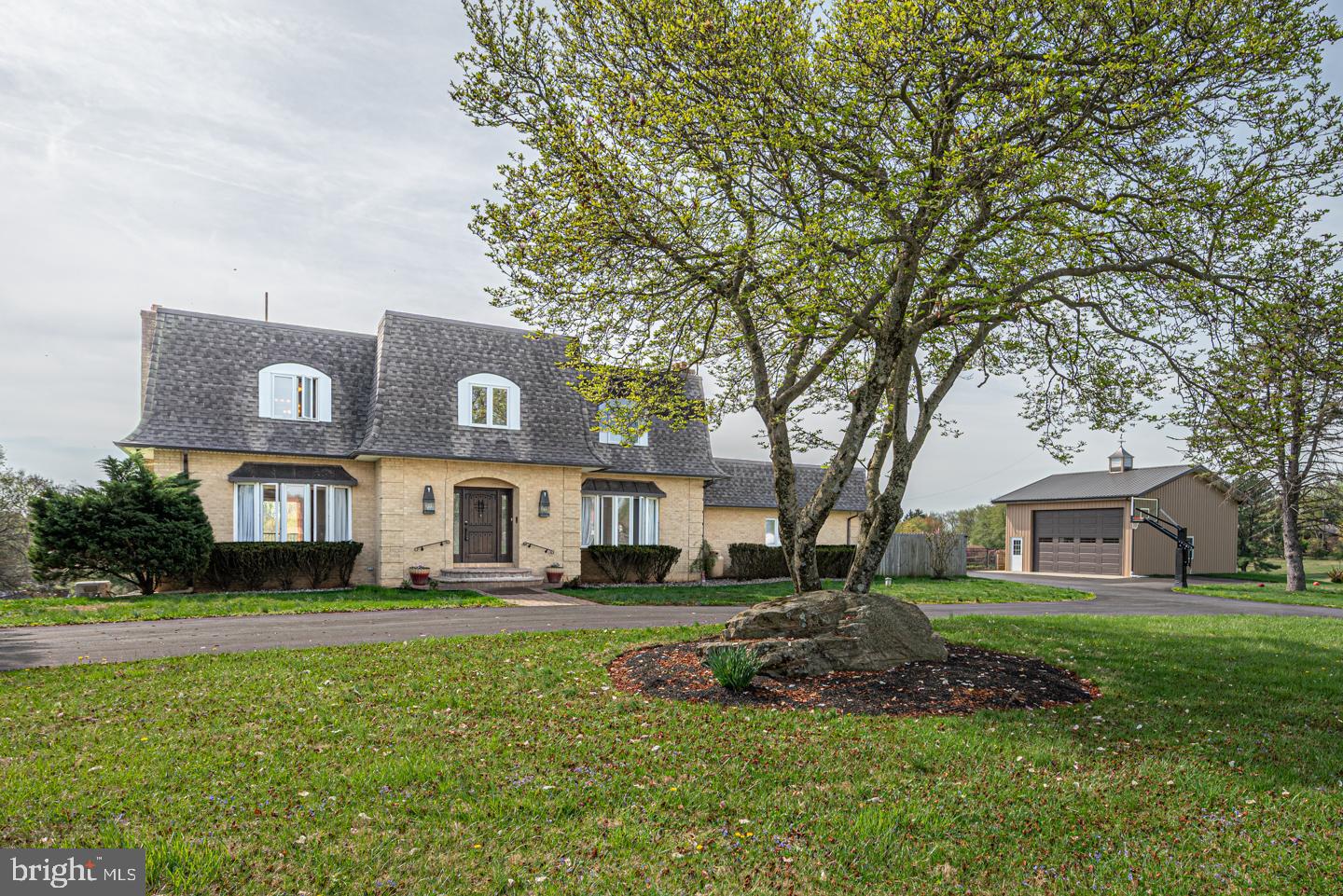 Welcome to this exceptional 5 bedroom home nestled on 4 acres, offering the perfect blend of luxury, comfort and peaceful country living. Situated on a quiet cul-de-sac neighborhood, this property provides both privacy and a true sense of community. Step inside to find a thoughtfully designed layout featuring a spacious living room with a cozy fireplace, as well as a separate family room with its own fireplace- ideal for relaxing or entertaining. The home is enhanced by stunning African tiger wood hardwood floors that add warmth  and elegance. The sunroom is a true highlight, filled with natural light and offering serene views of the surrounding landscape and pool. The finished walk out basement includes a full bath, creating a versatile space perfect for guests, recreation, home office or family movie night. Outdoors you will fall in love with the expansive deck overlooking picturesque views - perfect for morning coffee or evening gatherings. The in ground pool and cabana adds a resort like feel, making this home ideal for summer enjoyment. Additional features include a detached 8 car garage with a workshop area, providing ample space for hobbies or storage. Located within the highly acclaimed Rose Tree Media School District, this home offers convenience and top tiered education. If you're seeking space, beauty and tranquility this property is truly a must see