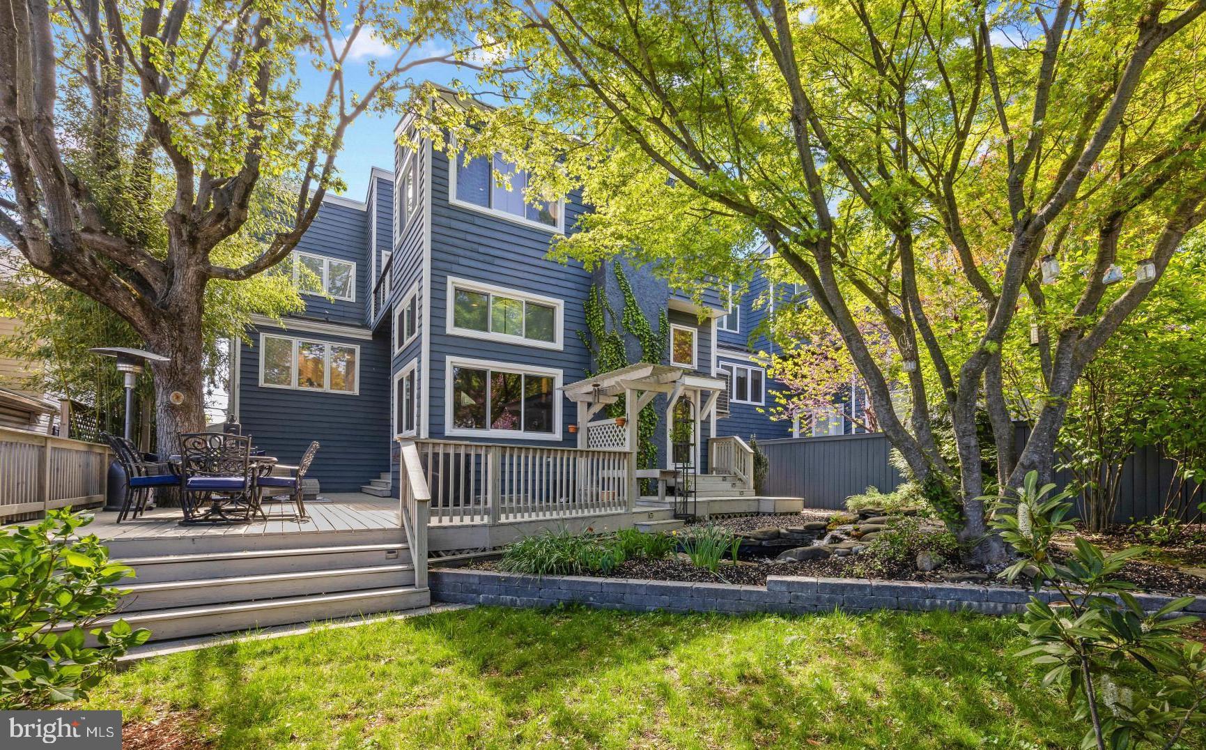 This exceptional 4 bedroom, 2 full baths, 2 half bath Coastal Contemporary residence captures the essence of Eastport living, where walkability, water access, and a vibrant coastal lifestyle come together seamlessly. Ideally situated just moments from marinas, restaurants, shopping, and the charm of downtown, the home is surrounded by the waterways that define this coveted location, offering effortless access to everything that makes Eastport so special.

Inside, soaring ceilings, beautiful hardwood flooring, and an open, light-filled floor plan create an inviting and functional living environment. The well-appointed kitchen features quality cabinetry, quartz countertops, JennAir appliances, and custom built-ins that blend everyday convenience with elevated design. A thoughtfully integrated dumbwaiter enhances ease between levels, while heated floors in the entryway and guest bath add a subtle layer of comfort.

Outdoor living is equally compelling, with a spacious wraparound deck designed for entertaining and a wine balcony off the primary suite that embodies relaxation and captures serene water views—perfect for quiet mornings or evening relaxation. The landscaped yard offers a peaceful retreat, highlighted by a pond with a cascading waterfall that adds both ambiance and privacy.

Additional features include a reverse osmosis water filtration system, multiple gas fireplaces, and efficient, well-maintained systems that support comfortable, low-maintenance living.

Rounding out the property is the rare advantage of a 2-car garage with built-in storage above, along with a private driveway—an invaluable feature in Eastport where parking is often at a premium. Combining location, lifestyle, and thoughtful design, this residence presents a unique opportunity to enjoy the best of Annapolis living. Welcome Home!