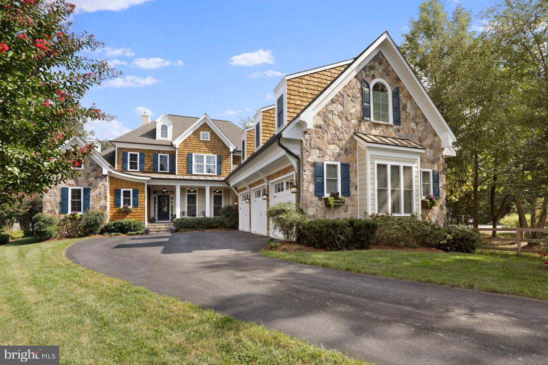 Severna Park Waterfront!

This stunning custom built 6,000 square foot home with deep water pier, saltwater pool, and large outdoor entertaining areas.  This 1.2-acre resort-like property is located on a private quiet, cul-de-sac, with 6 bedrooms and 6 1/2 baths.  The exterior is a combination of stone, cedar shake, and hardie plank siding and extensive crown and trim detail work.  A bluestone porch welcomes you as you enter the light filled, vaulted foyer and living room.  Large glass windows and soaring gas fireplace make this a beautiful setting for the views to a private, professionally landscaped garden, a fenced yard with pool and outdoor kitchen.

The attached open concept kitchen boasts granite counters, custom cabinets, stainless steel appliances and large pantry.   The massive island has a cozy seating area for 4.  There is also an informal eat-in dining area with huge windows that overlook the pool, private woods, yard, and massive Brazilian hardwood deck, perfect for your morning coffee, cocktails, or large group entertaining and outdoor seating.  Adjacent to this lovely kitchen is a butler's pantry and wet bar, which opens to the formal dining room.  A separate den just off the main floor kitchen and dining area has a second gas fireplace and large windows that also overlook the back yard, deck, and pool areas.

Additional first floor features consist of wide plank white oak flooring and custom molding details with 10' ceilings.  This level also has expansive master suite with a third gas fireplace, vaulted en-suite bath with jetted tub and separate shower, and large his and hers closets.  The master bedroom has a door leading to main floor deck.  The master suite, den, large office, laundry room and the 3-car garage make 1st floor living exceptionally easy.

When you step up the elegant staircase and cross the bridge overlooking the main living room area you will find three additional large bedrooms, each with their own en-suite baths and 9' ceilings with extensive crown molding and trim work.  A massive office/game room or au-pair suite complete with a full bath, wet bar, or kitchenette accessible from a separate second staircase, making this space on opportunity for whatever you can dream of!

On the lower level is a private gym and an 1800 SF large 2-bedroom 1 bath apartment, with hardwood floors, a full kitchen, laundry, dining area, and living room area with large windows.  Walkout the separate entrance to a private patio overlooking the pool, woods, and garden area.  This makes a perfect situation for extended family or rental income.

Stroll or golf cart down the relaxing woodland gravel path to your own private deep-water pier with 2 slips and beautiful views of the Magothy River.

The backyard has a custom-built saltwater pool, travertine patio, a tranquil pond with waterfall, fish and lily pads.  A gas grill and outdoor kitchen with plenty of seating makes entertaining a breeze.

All Blue Ribbon Schools!

A Must See!