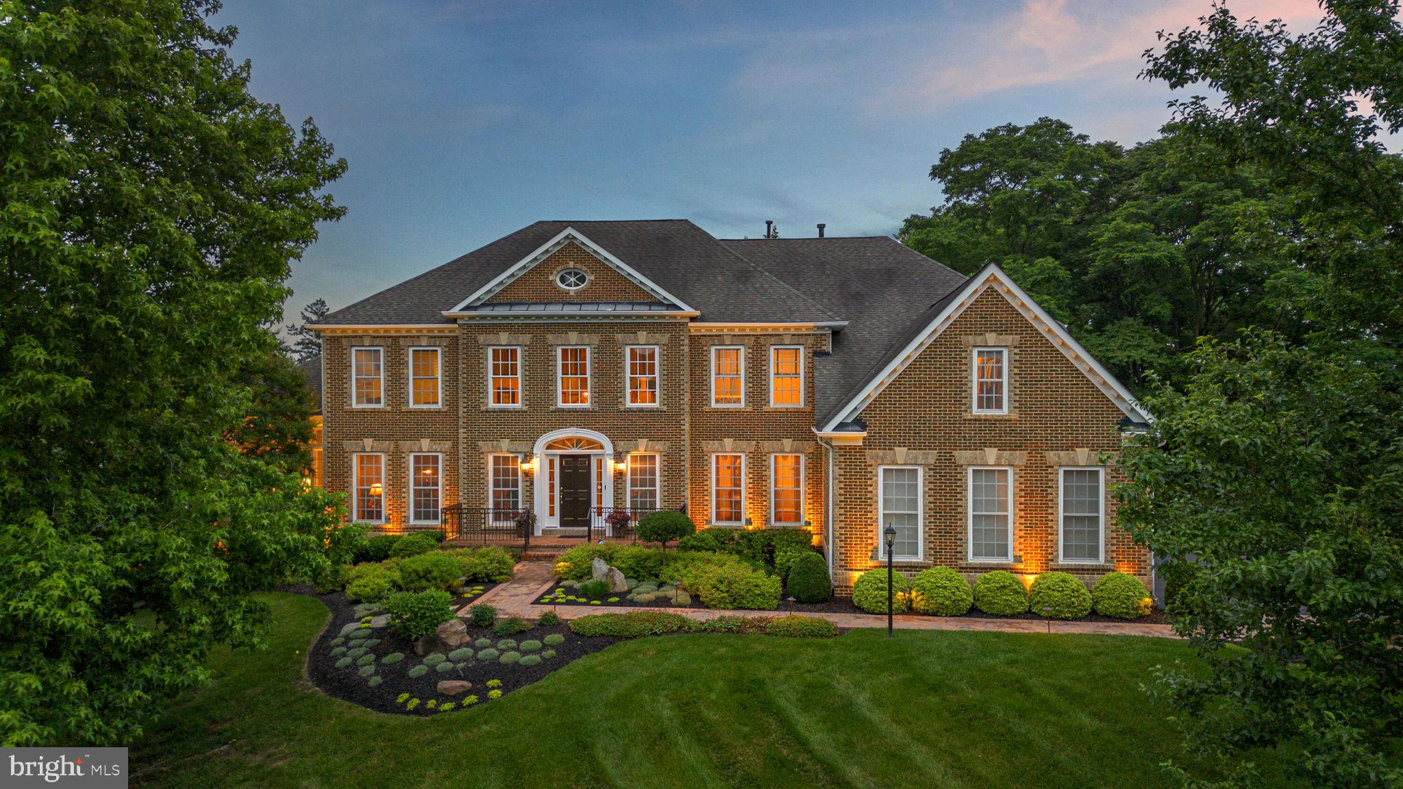 PRICE ADJUSTMENT! New price , yet same great schools (Sherwood ES, Farquhar MS, Sherwood HS)! Welcome to 21816 Gaithers Meadow Lane in Brookeville, Maryland—conveniently located between Baltimore and Washington, D.C. Majestically set on 1.38 acres of beautifully landscaped grounds, this luxurious brick-front estate offers timeless elegance and nearly 8,000 sq ft of finished space. With 5 bedrooms and 5 full bathrooms, this home includes 4 upper-level bedrooms each with private en suite baths, plus a 5th bedroom and full bath on the finished lower level—perfect for guests or extended living. The striking brick exterior is complemented by extensive hardscape, structured plantings, and natural stone elements that create a grand first impression.
MAIN LEVEL:
Enter into a dramatic double staircase foyer with hardwood floors and soaring ceilings. Expansive living spaces include a formal Living Room, sun-drenched Sunroom with tray ceiling, private Library, and a stunning 2-story Family Room with a wall of windows and fireplace. The  remodeled chef’s Kitchen features Thermador and Wolf appliances, double granite countertops, a center island with seating, walk-in pantry, and a cabinet with lift-up appliance storage. A sunny Breakfast Room opens to a vaulted Florida Room and a two-tier deck overlooking the private backyard. Additional highlights include a coffee bar, butler’s pantry, rear staircase, Powder Room, and a large Laundry/Mud Room with cabinetry and utility sink.
UPPER LEVEL:
The expansive Primary Suite is a true retreat, offering a Sitting Room, two custom walk-in closets, dressing room with triple mirrors, and a spa-like renovated bath with soaking tub, oversized frameless glass shower, dual vanities, private water closet, and tray ceiling. Three additional bedrooms, each with renovated en suite bath and walk-in closet, complete this level. Overlooks to both the foyer and family room below fill the space with light.
LOWER LEVEL:
Designed for entertaining and multi-functional living, the lower level offers a Media Room with fireplace and walk-out access to the patio, a large Rec Room, full Bar with dishwasher and refrigerator, and a Wine Cellar with tasting area. The 5th bedroom and full bath are ideal for guests or an au pair. A spacious Exercise Room offers flexibility for a gym or indoor recreation.
EXTERIOR:
Enjoy multiple outdoor zones including a two-level deck, lower patio, and lush tree-lined landscaping. The attached 3-car garage and extended driveway provide ample parking.
RECENT UPGRADES & FEATURES:
Re-landscaped front & sides with underground drainage, irrigation, and exterior lighting
3-zone HVAC & whole house humidifier (2023)
New wood flooring in upper bedrooms (2024)
Hot water heater (2021)
Toto toilet seats (2020)
Wider stone walkway (2020)
Luxury engineered wood flooring & gym rubber flooring (2022)
ADT custom 36-zone security system
Exterior storage shed with ramp & gas generator
Six TVs (4 Samsung, 2 Sony) and 2 Sonos soundbars convey
TOP-RATED SCHOOLS:
Sherwood Elementary, Farquhar Middle, Sherwood High, plus nearby private options such as Good Counsel, Friends School, and St. John’s Episcopal.
Meticulously maintained and thoughtfully designed—this is luxury living at its finest.