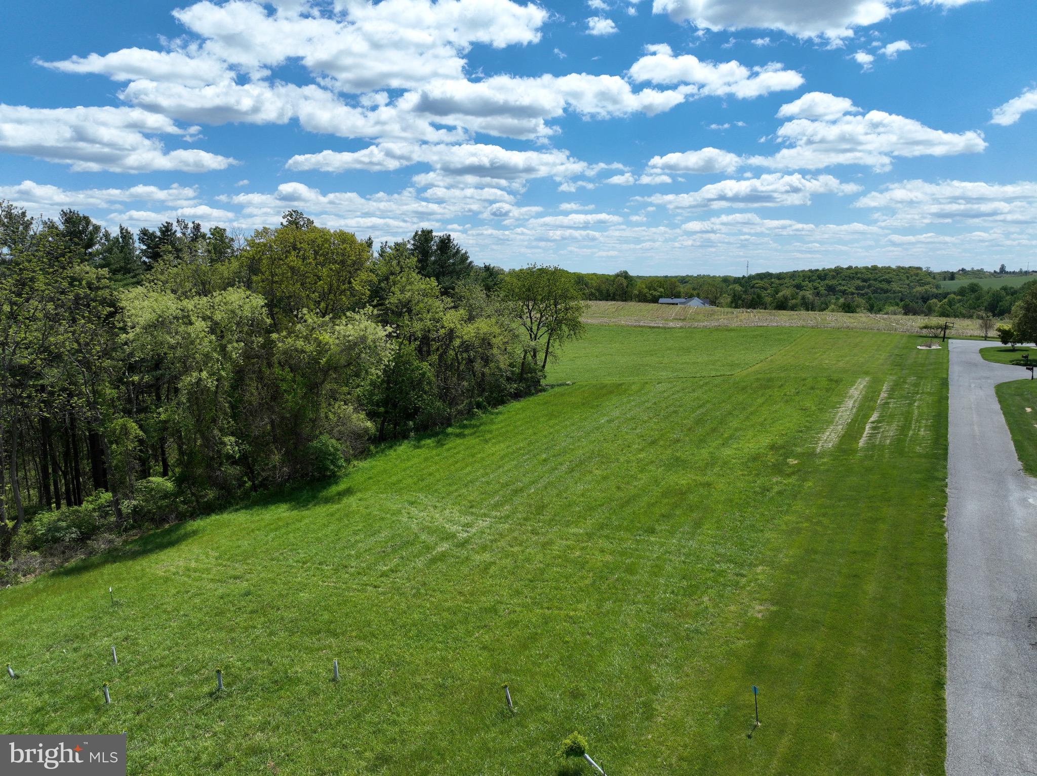 Escape the noise, the congestion, and the pace of city life—and step into the breathtaking countryside just outside Westminster, MD. This 7.36‑acre masterpiece sits north of town off Route 27, offering some of the most captivating views in Carroll County. Rolling hills stretch toward the horizon, meeting wide‑open skies that deliver unforgettable sunsets and a sense of peace you simply can’t find anywhere else.

With a stunning blend of open fields framed by wooded edges, this property offers the ideal homesite—mostly open land perfectly suited for building the custom home you’ve always imagined. Whether you envision a modern farmhouse, a luxury estate, or a quiet country retreat, this land provides the canvas to bring it to life.

A perc test is already underway, with 2 of 3 holes approved for a sand mound system. Once complete, a variance will be submitted for slopes over 12%, with the entire process expected to wrap up in 4–5 weeks. Make your offer contingent and secure this rare opportunity before it’s gone.

Convenience is already in place with electric at the road, and there may be an additional access option from White Fence Drive off Brehm Road, giving you flexibility in designing your driveway and homesite layout.

And here’s something truly exceptional: engineering reports indicate the property may qualify for up to $75,000 in Tree Bank income from the county—an incredible financial advantage for the future owner.

Land with this level of beauty, privacy, convenience, and potential is almost never available in Carroll County. This is more than a lot—it’s a lifestyle, a legacy, and a once‑in‑a‑generation chance to build something extraordinary.

Don’t let this opportunity slip away. Schedule your private tour today and experience the magic of this property for yourself. "MOTIVATED SELLER!"