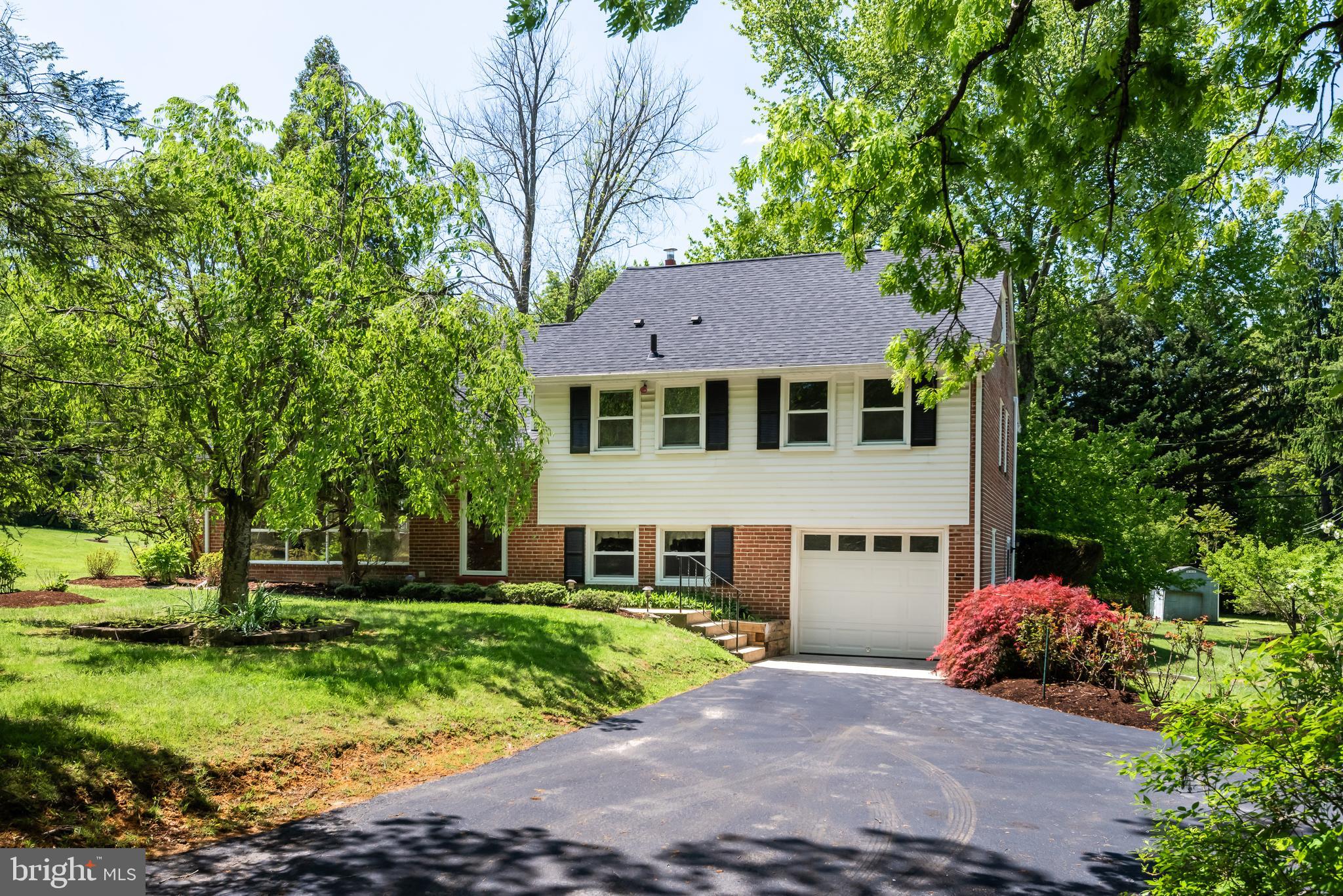 Welcome to 824 Old Eagle School Road, a solidly built and nicely updated four-bedroom home in the heart of the award-winning Tredyffrin-Easttown School District. This property features four finished living levels, beautifully refinished hardwood floors, numerous major system upgrades, and a deep rear yard with mature landscaping. A rare opportunity to own a well-maintained home with a nice yard in Wayne. The entrance foyer opens to a bright, sunny living room highlighted by a wall of windows and a wood-burning fireplace with a brick surround and a stainless steel chimney liner installed in 2019. The formal dining room is perfectly suited for family gatherings and holiday celebrations. The eat-in kitchen offers raised-panel cabinetry, generous granite counter space, stainless steel appliances, and a brand-new electric range installed in April 2026. A doorway off the dining room leads to the rear deck overlooking the deep grounds with mature plantings and shade trees—an ideal setting for grilling, outdoor dining, and entertaining. The lower level features a nicely finished family room with direct access to the one-car garage and a large laundry/utility room. The laundry area and powder room were remodeled in 2022, completing this comfortable and functional level of the home. The second floor is home to the owner’s suite with a private bathroom, along with two generously sized bedrooms served by an updated hall bathroom. The finished third floor offers flexible living space that could function as a fourth bedroom, home office, playroom, or additional family room. A floored attic provides tremendous storage space and future potential. Recent upgrades and improvements include a new high-efficiency air conditioning system installed in 2025, a new roof in 2022, many energy-efficient replacement windows in 2023, refinished hardwood floors in May 2026, new front and laundry doors in 2022, a new garage door in 2019, a gas water heater installed in 2019. 824 Old Eagle School Road is a wonderful place to call home. Located close to the King of Prussia Town Center, Valley Forge National Park and the shops, restaurants and trains of The Main Line. This is the one, welcome home!