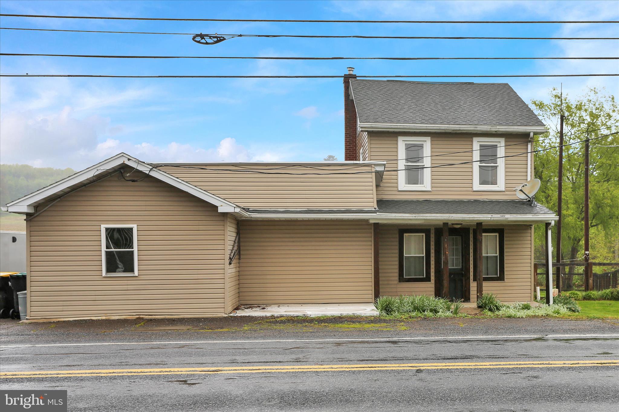 Don’t miss this unique opportunity to own a spacious 3-bedroom, 2-bath home with the rare added benefit of a commercially zoned 2,500 sq ft detached garage/shop — formerly operated as a beer distributor — offering incredible potential for business use, storage, hobbies, or future investment opportunities.
Situated on a generous half-acre lot, the home blends classic character with functional living space and thoughtful updates throughout. Inside, you’ll find large living and dining areas filled with natural light, highlighted by a beautiful electric fireplace that adds warmth and ambiance. The kitchen features custom cabinetry and practical touches, while convenient main-floor laundry makes everyday living easier. The first floor also includes a spacious bedroom with ample closet space and an updated full bathroom.
Upstairs, you’ll find two additional bedrooms along with a second full bathroom featuring a relaxing soaking tub. Outside, enjoy a large deck, fenced yard, and fire pit area perfect for entertaining, gardening, or simply unwinding outdoors.
What truly sets this property apart is the oversized detached commercial building. With approximately 2,500 square feet of commercially zoned space, the possibilities are endless — ideal for contractors, automotive enthusiasts, small business owners, warehouse/storage needs, or workshop space.
Properties offering both residential comfort and commercial flexibility are hard to find. Schedule your private showing today and explore everything this versatile property has to offer.