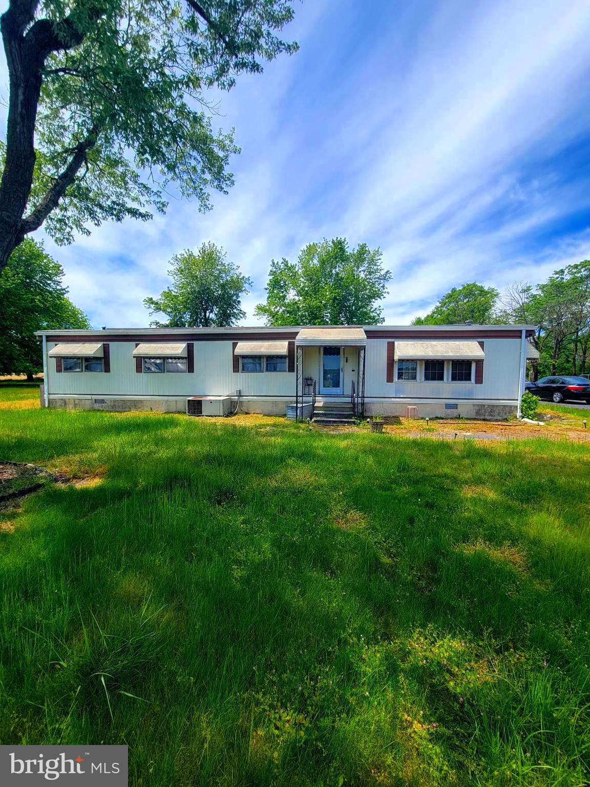 This property features a 3 bed, 2 bath doublewide on just under an acre of land with 2 sheds and a detached 2 car garage. The garage has it's own breaker box and two garage door openers. The doublewide offers a traditional layout and needs to be renovated. The  lot also offers a large blacktop driveway. Property to be sold AS IS. Schedule to see this property today!