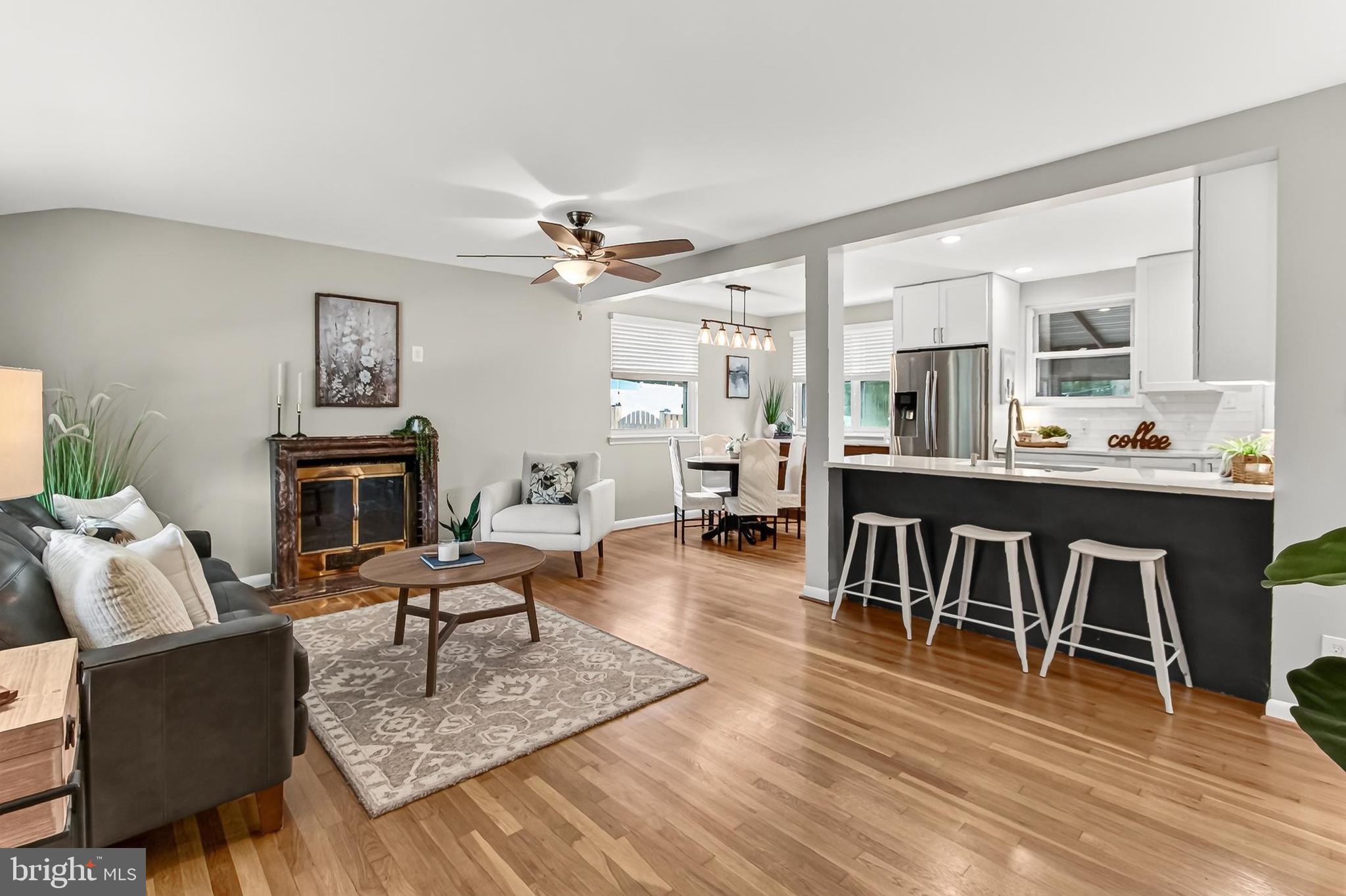 Welcome to 6927 Fern Lane in Annandale, Virginia! A wonderful blend of classic charm, comfortable living, and everyday convenience awaits in this beautifully maintained 3-bedroom, 2-bath rambler nestled on a quiet street in Annandale's established Columbia Pines community. Set on an expansive lot, this inviting home offers a tailored brick and siding exterior, attached garage, paved parking pad, three-season sunroom, stamped concrete patio, and a spacious fenced backyard designed for both relaxation and entertaining. Inside, rich hardwood flooring, soft neutral paint, generously sized rooms, and abundant natural light create a warm and welcoming atmosphere, while meticulous care and opportunities for future personalization make this residence truly special.

Fine craftsmanship begins in the sun-filled living room, where a large picture window bathes the space in natural light and a cozy fireplace creates an inviting focal point for gathering with family and friends. The adjoining dining room provides an elegant setting for everything from everyday meals to holiday celebrations, enhanced by a multi-pendant chandelier that lends tailored distinction. At the heart of the home, the renovated kitchen is sure to delight with sparkling quartz countertops, handcrafted cabinetry, metro tile backsplash, and quality stainless steel appliances including a gas range and French door refrigerator. Just beyond, the charming three-season sunroom creates a peaceful extension of the home's living space before opening to the stamped concrete patio and expansive fenced backyard—creating a seamless setting for outdoor dining, entertaining, gardening, or simply enjoying the tranquil surroundings.

Down the hall, three bright and spacious bedrooms feature warm hardwood flooring and generous closet space while sharing access to the beautifully updated hall bath showcasing a vessel-sink vanity, sleek fixtures, and spa-inspired tile finishes. The finished lower level expands the home's versatility with an inviting family room accented by luxury flooring and natural wood accents, creating the perfect destination for movie nights, recreation, hobbies, or quiet evenings at home. A beautifully updated full bath with a frameless glass shower, dedicated workshop, laundry center, walk-up access, and abundant storage solutions further enhance the home's comfort, flexibility, and everyday functionality.

Columbia Pines offers a peaceful residential setting while placing the very best of Annandale within easy reach. Commuters will appreciate convenient access to Route 236, I-495, Express Lanes, Metro Bus service, and major commuter routes throughout Northern Virginia. Nearby shopping, dining, and everyday conveniences include Markham Shopping Center, the Annandale Farmers Market, Silverado, Jukebox Diner, Aldi, and countless local favorites. Outdoor enthusiasts will enjoy Greenspring Gardens and Mason District Park, where scenic trails, sports facilities, picnic areas, and the popular Spotlight by Starlight summer concert series provide year-round recreation. Combining enduring quality, comfortable living, and an exceptional location, this inviting home offers a lifestyle ready to enjoy from the very first day. Welcome Home!