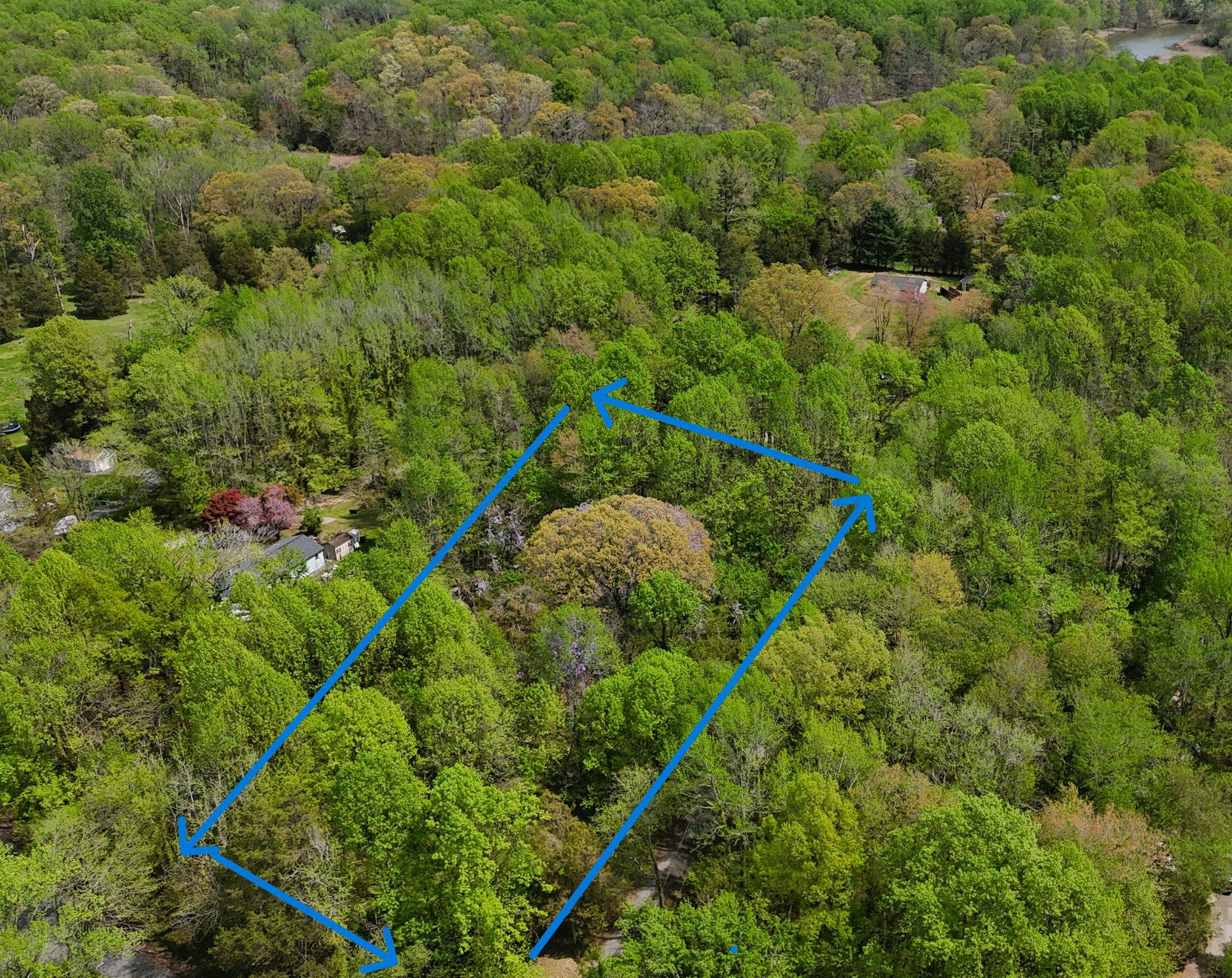 The work of finding land like this is the hard part. Here, it is already done.
Two acres of buildable wooded land in one of Anne Arundel County's most remarkable locations.

This parcel in Edgewater is tucked within the footprint of the Smithsonian Environmental Research Center, bordered by SERC conservation land to the South and East. Your backyard borders 2,650 acres of protected forest, wetland, and Chesapeake watershed research land. That natural setting is protected and permanent.

 The land is flat, perc-approved, and ready for a single-family home with an accessory dwelling unit. Anne Arundel County permits one ADU per lot with no minimum lot size requirement, giving you flexibility for family, guests, a rental, or a studio. A feasibility study confirming site suitability is complete.

The site sits outside the Chesapeake Bay Critical Area as well as the 100-year flood plain. Soils are well-drained. Old Muddy Creek Road is fully improved.
This is a rare find in a historic, tight-knit community near the South River, along the western shore of the Chesapeake Bay. The road is quiet and the setting feels like a getaway, and yet everything is nearby.
 
There are extensive shopping and dining choices just five minutes away. For the water and boating enthusiast, there are nine marinas just minutes from your door. Mayo Beach Park and Beverly Triton Nature Park are 7 miles away, Quiet Waters Park 10 miles, and Annapolis City Dock just 11.
Washington, D.C. is 30 miles away, Baltimore 36 miles. Fort Meade, NSA, and Joint Base Andrews are all an easy commute.

Some land just feels different. This is one.
Bring your dreams & your builder!

Plat, perc approval, and feasibility study available for review.