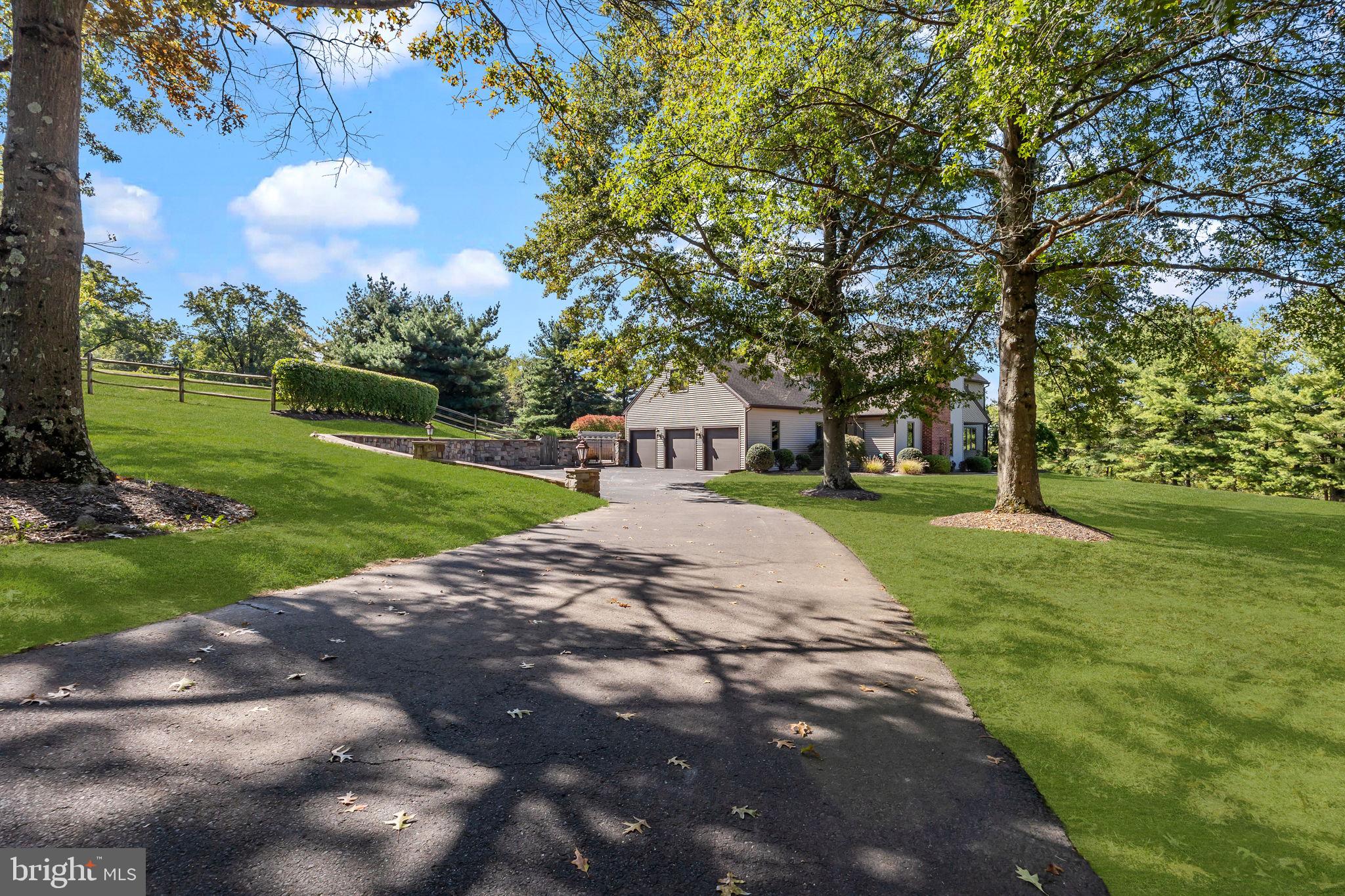 Welcome home to this rare one-acre exquisite Bucks County estate—tucked away in a quiet cul-de-sac and professionally designed to blend timeless craftsmanship with modern amenities. Situated in the award-winning Central Bucks School District and just minutes from the vibrant downtown of Doylestown, the property offers the best of both worlds: 65 miles to New York City, 25 miles to Philadelphia, and equidistant to Newark (EWR) and Philadelphia (PHL) airports for seamless travel.

The Heart of the Home:
At the center is a chef’s kitchen designed for both beauty and performance: custom cabinetry, oversized island, integrated Thermador refrigerator, La Cornue dual-oven induction range, brass fixtures with instant boiling/filtered water, deep basin sink, porcelain countertops with full-height backsplash, Bosch built-ins, and a concealed coffee nook. A built-in Sonos speaker system with Bluesound amplifier serves the kitchen and dining spaces, creating an ideal setting for entertaining.

Inspired Interiors:
Every surface has been elevated with enduring design: new oak hardwood floors, oak beam accents, custom fireplace mantel, arched architectural openings, designer lighting, brass finishes, and fresh interior paint. The sunroom boasts a new roof, skylights, and ceiling fan, while exterior upgrades include new front, sliding, and French doors.

Upstairs, a beautifully constructed oak staircase leads to the primary suite with two large closets. Three additional bedrooms and two full baths complete the upper level. 

Lower Level Living:
The lower level offers expansive lifestyle options, including a spacious family room with soaring wood-beamed ceilings, an entertainment area, two wood-burning fireplaces painted black for a modern finish, and a powder room featuring a marble vanity with brass hardware. A refinished basement adds immense value with a state-of-the-art fitness studio.

Outdoor & Mechanical Highlights:
Designed for everyday relaxation and entertaining, the grounds feature a heated inground saltwater pool with waterfall and spa, an outdoor shower, and a six-person sauna. A propane backup generator provides peace of mind.

Additional Features:
A new laundry room includes a custom oak countertop, GE washer & dryer, and drying rack, The three-car garage provides ample storage.

For the discerning buyer, this home represents more than luxury—it is an estate-level investment blending durability, design, and location. Rarely does a property so seamlessly unite long-term value with everyday livability.

Furniture and gym equipment negotiable for a turn-key purchase.