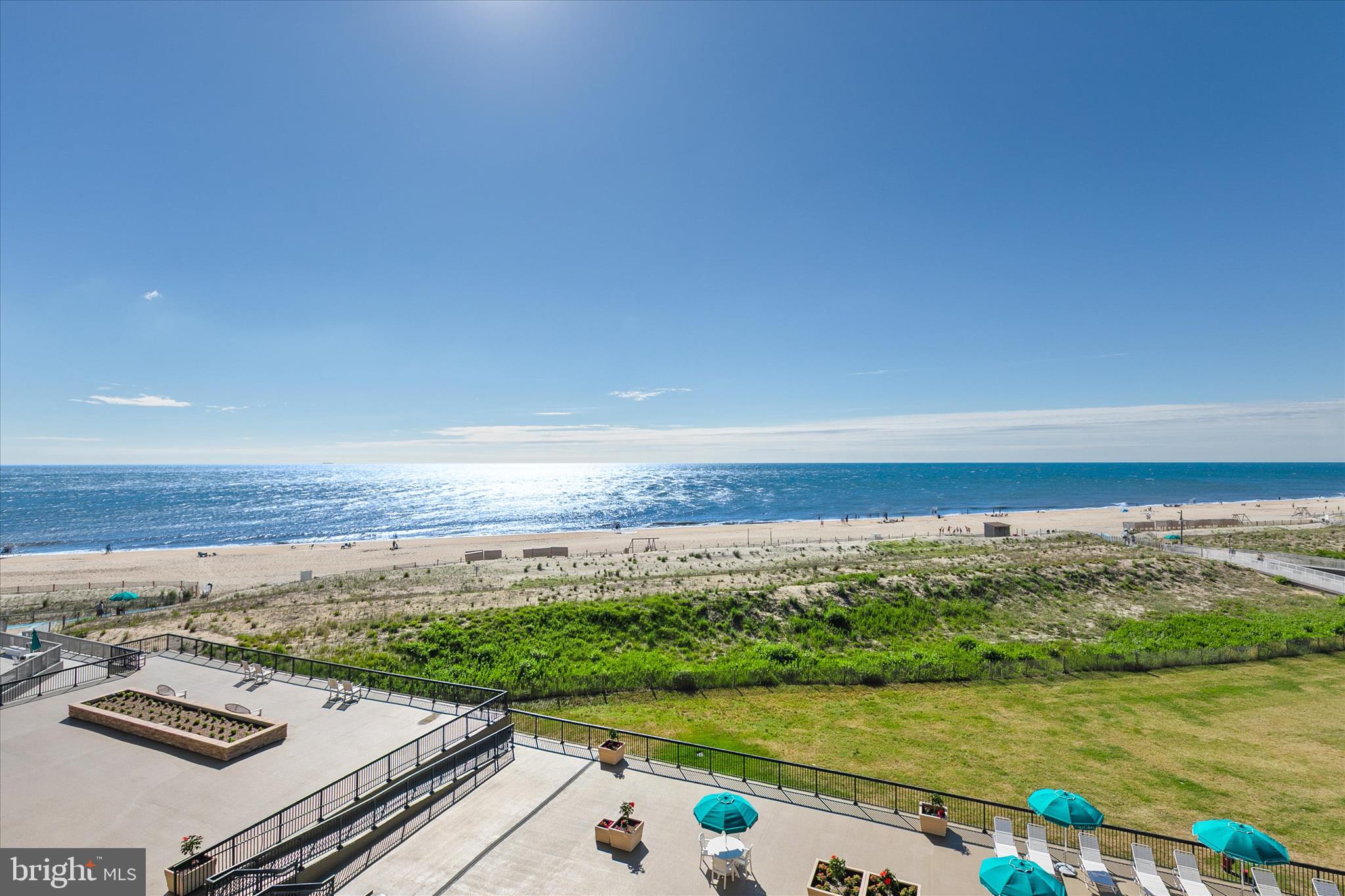 Welcome to this nicely maintained 2-bedroom, 2-bath oceanfront condominium in Dover House, offering one of the most spectacular views in all of Sea Colony. Perched on the 5th floor, this home captures breathtaking panoramic views of the Atlantic Ocean and pristine beach from the moment you step through the front door.
Lovingly owned and never rented, this exceptional property has been thoughtfully updated over the years. The coastal-inspired kitchen features updated white cabinetry with beautiful, speckled quartz countertops and white appliances.   Both the living room and oversized primary bedroom offer updated sliding glass doors that lead directly to the oceanfront balcony, maximizing natural light and showcasing the stunning views.
The spacious primary suite enjoys incredible ocean views and includes an updated bath featuring a newer vanity, 12" x 12" tile flooring, and a beautifully tiled shower surround accented with decorative tile details. The guest bath has also been updated with a newer vanity, flooring, and tiled shower surround.
Additional improvements include an updated HVAC system and ceiling fans in the living room and both bedrooms. The generous guest bedroom features plantation shutters and a floor-to-ceiling window, flooding the room with natural light.
Step outside to the expansive balcony and enjoy a wide-span view of the coastline, beach, and ocean—a perfect setting for morning coffee, afternoon relaxation, or evening moonlights.
Dover House offers one of Sea Colony's premier oceanfront locations, being just steps from the indoor pool and fitness center located in the neighboring Edgewater House.
This is a rare opportunity to own a lovingly cared-for oceanfront retreat in one of Bethany Beach's most sought-after resort communities.
Magnificent views, exceptional updates, and a never-rented history make this Sea Colony gem truly special.