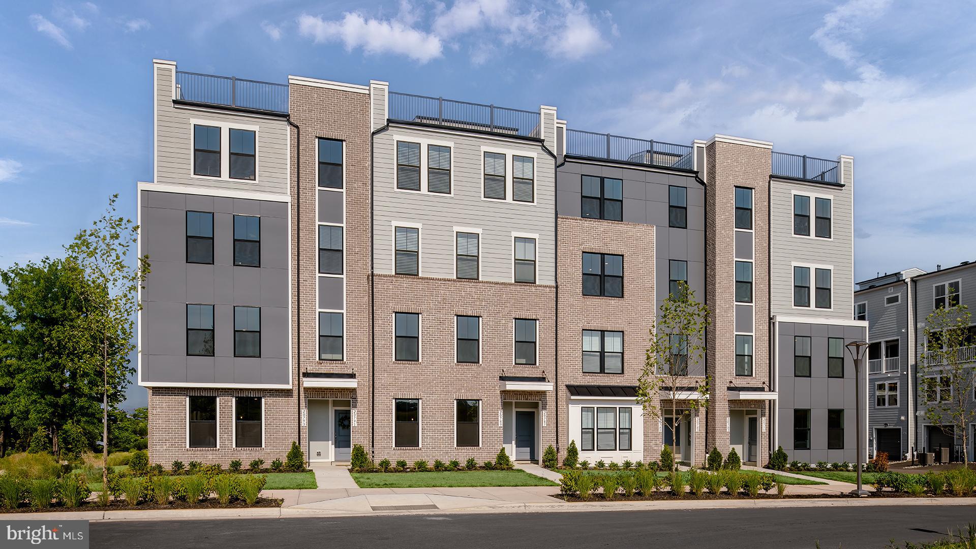 **OFFERING UP TO $25K IN CLOSING COST ASSISTANCE WITH USE OF APPROVED LENDER AND TITLE.**
New Construction, luxury 2-level condo located in the Kincora community in Dulles, Virginia for end of Summer move-in. This end unit Rosslyn floorplan is a perfect blend of style and functionality for modern living. The first floor showcases a spacious gathering room that seamlessly connects to the rest of main level. Enjoy a well-appointed chef's kitchen that features upgraded stainless-steel GE appliances including exposed hood and wall microwave, peninsula island, white cabinetry and quartz countertops. Additionally, enjoy luxury vinyl plank flooring throughout the kitchen, a walk-in pantry, a convenient powder room, and a 1-car garage. Upstairs, the primary suite offers a private bathroom with Roman shower including frameless shower doors, two shower heads and tile seat and floor for a spa like experience. With two walk-in closets, this primary bedroom proves to be a luxurious retreat. Two additional bedrooms, a hall bathroom, and a laundry room including full size washer/dryer and deck off of secondary bedroom, complete the second floor, offering comfort and convenience for the whole household. Experience the best of modern living with the Rosslyn home design! Don’t miss your chance to own a low-maintenance home in Kincora, an interactive community in Loudoun County. Kincora boasts 165 acres of preserved land, walking trails, retail, office space, and convenient access to Route 7 and Route 28.  *Photos may not be of actual home. Photos may be of similar home/floorplan if home is under construction or if this is a base price listing