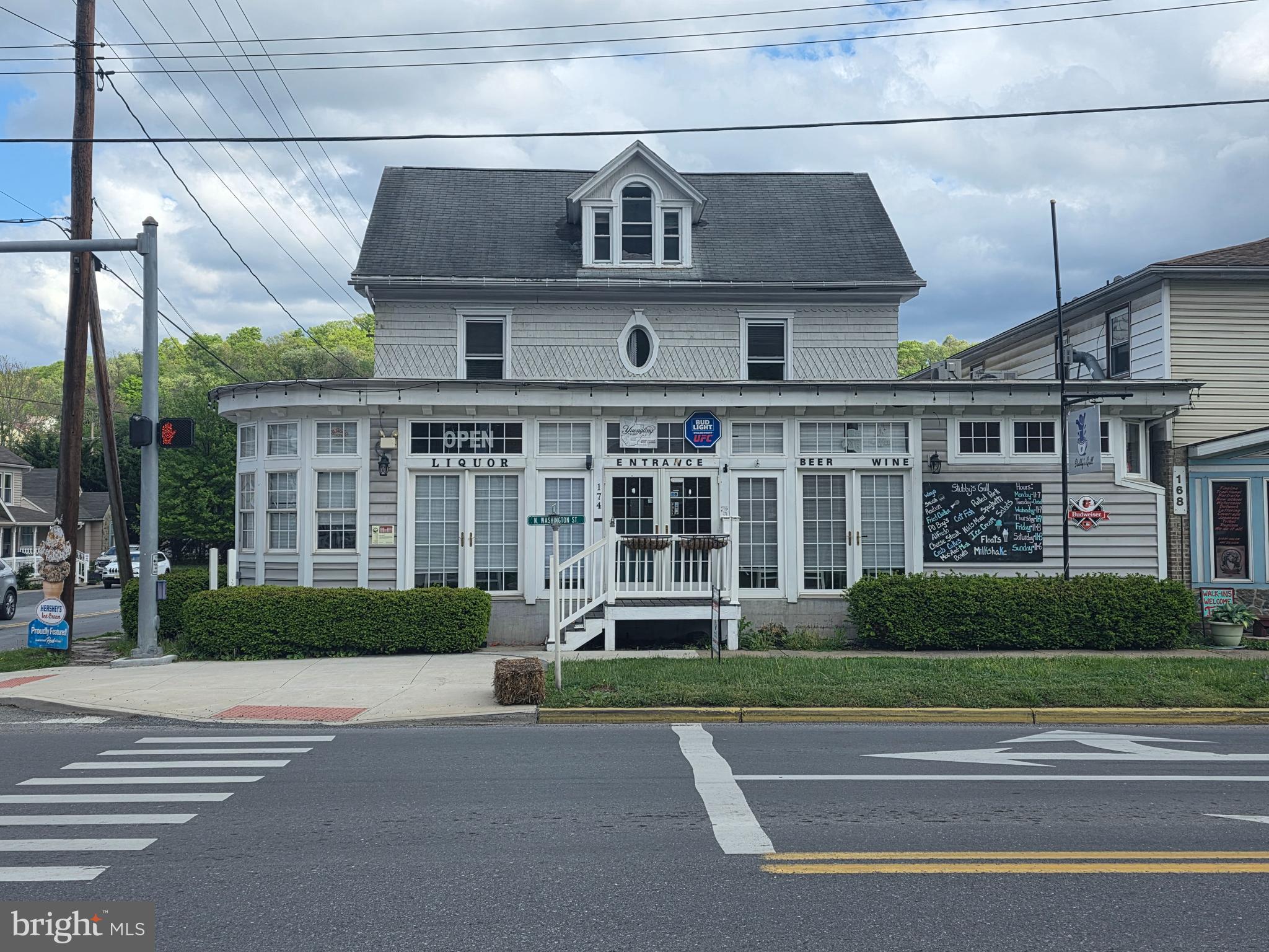 Great Business Opportunity: located in the Town of Bath (Berkeley Springs) this has so much to offer.
Featuring a restaurant with a Bar, plenty of seating, fireplace in dining area, and a fully operational commercial kitchen.  With the rooms upstairs, this could easily be operated as a Bed & Breakfast, Airbnb or long term rentals due to having its own entrance. All equipment & furniture convey with this business. All this is walking distance to the spas, downtown shops, movie theater and the weekend farmer's market. Come start your business and be a part of fabulous town of Bath/Berkeley Springs, WV.
Many photos of restaurant are from previous MLS listing. Some furniture on upper level is different than in the photos.