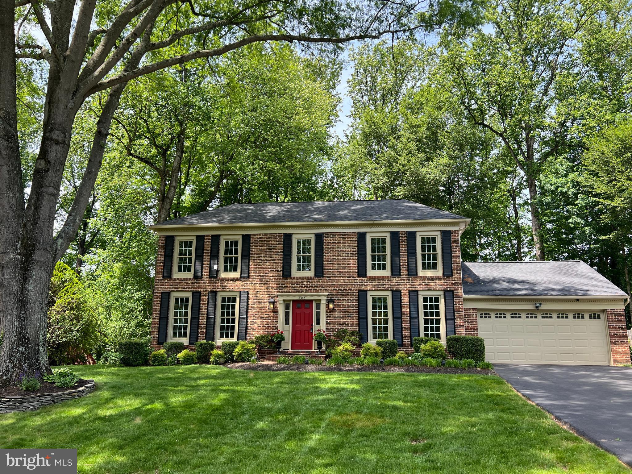 Sellers took a sight-unseen offer they could not refuse. Bellamine Court is a stately center hall colonial nestled on a peaceful cul-de-sac in the prestigious Langley Oaks community of McLean. This gracious 6-bedroom, 4.5-bath home offers timeless charm, thoughtful design, and a versatile layout perfect for modern living. Sited on nearly half an acre of flat, beautifully-landscaped grounds, it blends comfort, functionality, and elegance in one of Northern Virginia’s most sought-after neighborhoods.

A classic brick façade, mature landscaping, and a welcoming front walkway create immediate curb appeal. Inside, the light-filled foyer sets the tone for the home’s warm and inviting atmosphere, with large windows that showcase views of the lush front and rear yards.

To the left of the entry is a spacious formal living room bathed in natural light—ideal for entertaining or quiet relaxation. To the right, a private den offers an excellent home office or reading nook with serene views of the front garden. This flexible space is perfect for remote work or quiet reflection.

At the heart of the home is a charming kitchen designed for both everyday living and entertaining. It features abundant cabinetry, ample counter space, a breakfast area, and a distinctive wood-burning fireplace that adds warmth and character. This cozy feature invites gathering on cool mornings or relaxed evenings over family meals.

The kitchen flows seamlessly into the expansive family room, a true highlight of the home. This central gathering space includes high ceilings, hardwood flooring, and French doors leading to a spacious deck—creating an effortless connection between indoor and outdoor living. The deck overlooks the large, flat backyard bordered by mature trees, offering both privacy and open space for play, gardening, or outdoor entertaining.

Adjacent to the family room is a formal dining room that comfortably hosts large celebrations or intimate dinners. Designed with flexibility in mind, this room could be converted into a primary or guest bedroom with an ensuite bath—ideal for main-level or multigenerational living.

Also on the main level is a bonus room, currently used as an exercise space. With access to a secondary entrance, it offers excellent potential for a mudroom, laundry hub, dog spa, or gardening prep area. Its size and location provide endless customization options.

Upstairs, the primary bedroom offers a peaceful retreat with a walk-in closet and a spacious ensuite bath with skylight. Four additional bedrooms on this level are served by a well-appointed hall bathroom. Each room provides comfortable living quarters or creative flex space for growing families.

The finished lower level significantly extends the home’s footprint. A large recreation room is perfect for a media center, game room, or play area. Two additional multipurpose rooms can serve as guest bedrooms, offices, studios, or gyms. A full bathroom on this level adds convenience, and ample storage ensures the home stays organized.

The backyard is a rare gem in Langley Oaks: flat, usable, and private. There's room for a playset, garden, firepit, or even a future pool. The deck offers an ideal setting for grilling, outdoor dining, and soaking in the surrounding greenery.

6506 Bellamine Court’s location offers the best of both worlds—peaceful suburban living with unmatched access to local amenities. Just a short walk away is Langley Oaks Park, featuring wooded trails for walking and biking. Nearby Clemyjontri Park is a beloved community destination with inclusive playground equipment for all ages and abilities.

Families will appreciate the home’s placement in the highly regarded Langley High School pyramid—Churchill Road Elementary, Cooper Middle, and Langley High—consistently ranked among the top public schools in Virginia.

Commuters enjoy convenient access to major routes, making trips to Washington, D.C., Tysons Corner, and Maryland effic