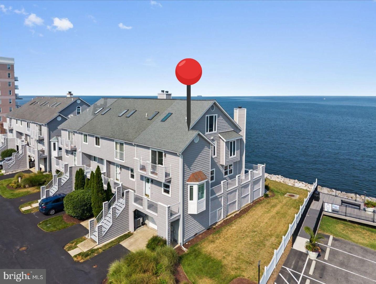 Rich solid bamboo flooring flows throughout the main living areas, while replacement windows maximize the breathtaking Bay views. The remodeled gourmet kitchen features quartz countertops, stainless steel appliances, and opens to a full-width waterfront deck—perfect for morning coffee, outdoor dining, or simply watching the boats pass by.

The spacious family room also opens onto a private waterfront deck, creating seamless indoor and outdoor living. Upstairs, the primary suite becomes your personal waterfront retreat with its own private deck overlooking the Chesapeake Bay, beautifully updated bath, and the convenience of a dedicated washer and dryer. Two additional bedrooms enjoy water views as well, allowing family and guests to wake up to the beauty of the Bay every day.

The walk-out lower level offers even more flexibility with a second washer and dryer, access to a stamped concrete waterfront patio, and a covered sitting area just steps from the shoreline—an ideal place to unwind after a day on the water.

Residents enjoy exclusive access to a private community pier complete with a boat lift and fishing opportunities. Every Independence Day, neighbors gather to watch the spectacular fireworks display reflected across the Chesapeake Bay, creating a tradition you'll look forward to year after year.

Located less than an hour from Washington, D.C., this home offers an exceptional primary residence, weekend escape, or second home without the hassle of Bay Bridge traffic. Enjoy the charm of Chesapeake Beach with its waterfront boardwalk, community beach, farmers markets, local breweries, boutique shopping, restaurants, outdoor concerts, marinas, and year-round events—all just minutes from your door.

If you've been searching for true Chesapeake Bay waterfront living with modern updates, unforgettable views, and an unbeatable coastal lifestyle, this is the one.